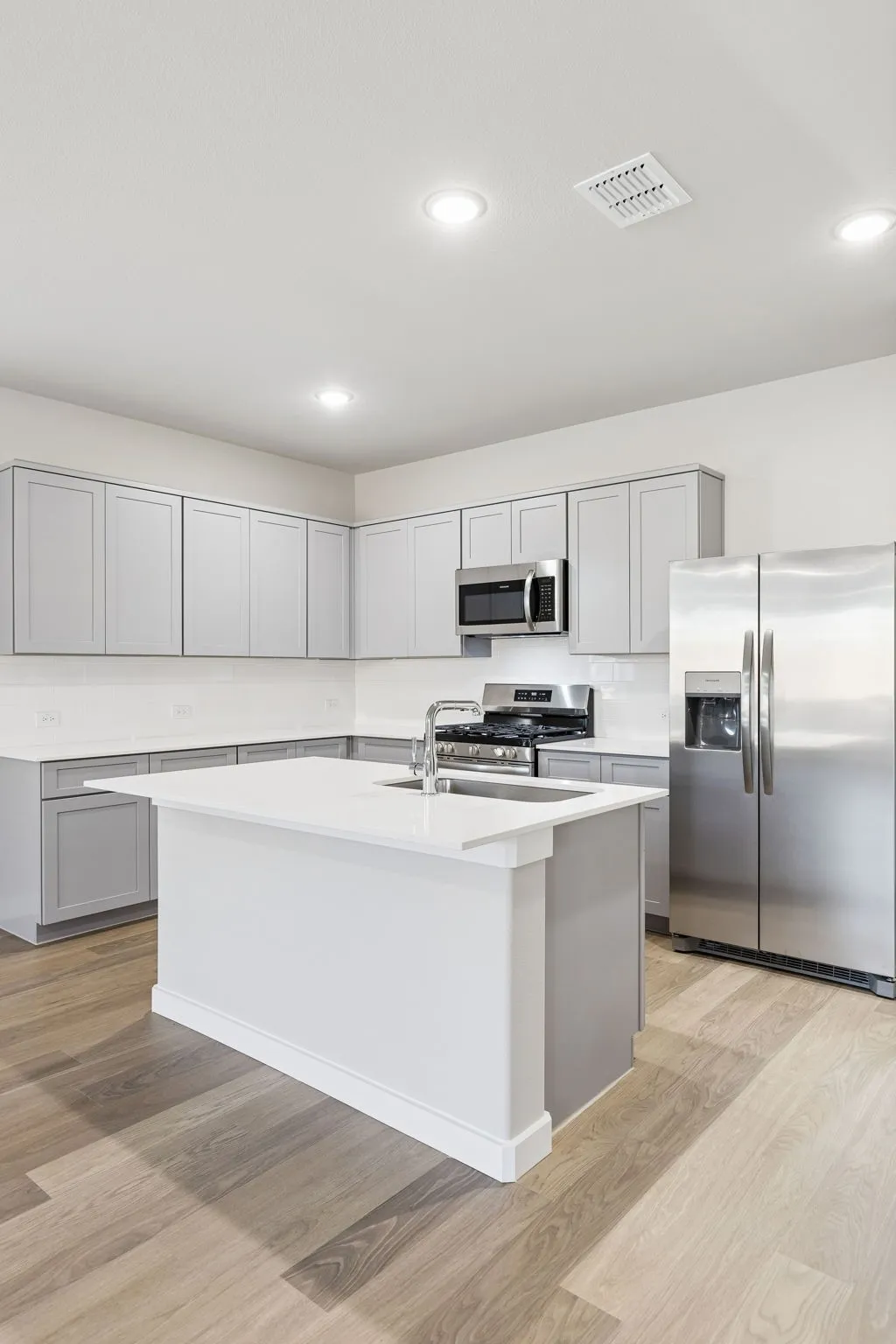 Kitchen in the Haylee home plan by Trophy Signature Homes - REPRESENTATIVE PHOTO