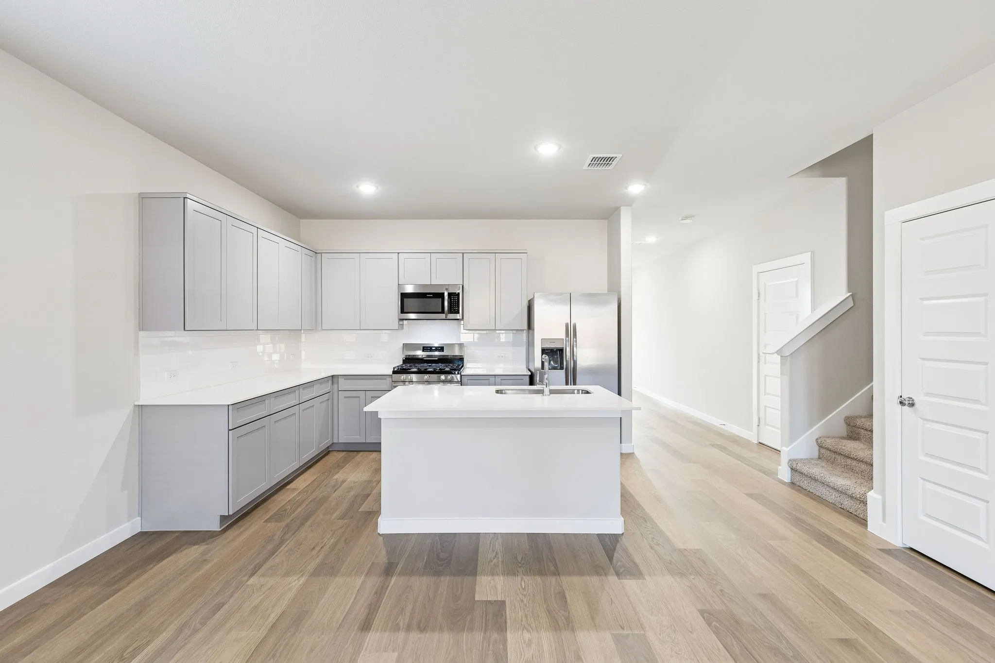 Kitchen in the Haylee home plan by Trophy Signature Homes - REPRESENTATIVE PHOTO