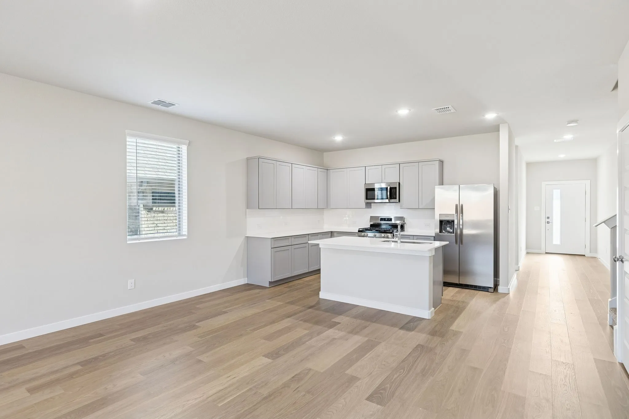 Kitchen and Dining Room in the Haylee home plan by Trophy Signature Homes - REPRESENTATIVE PHOTO