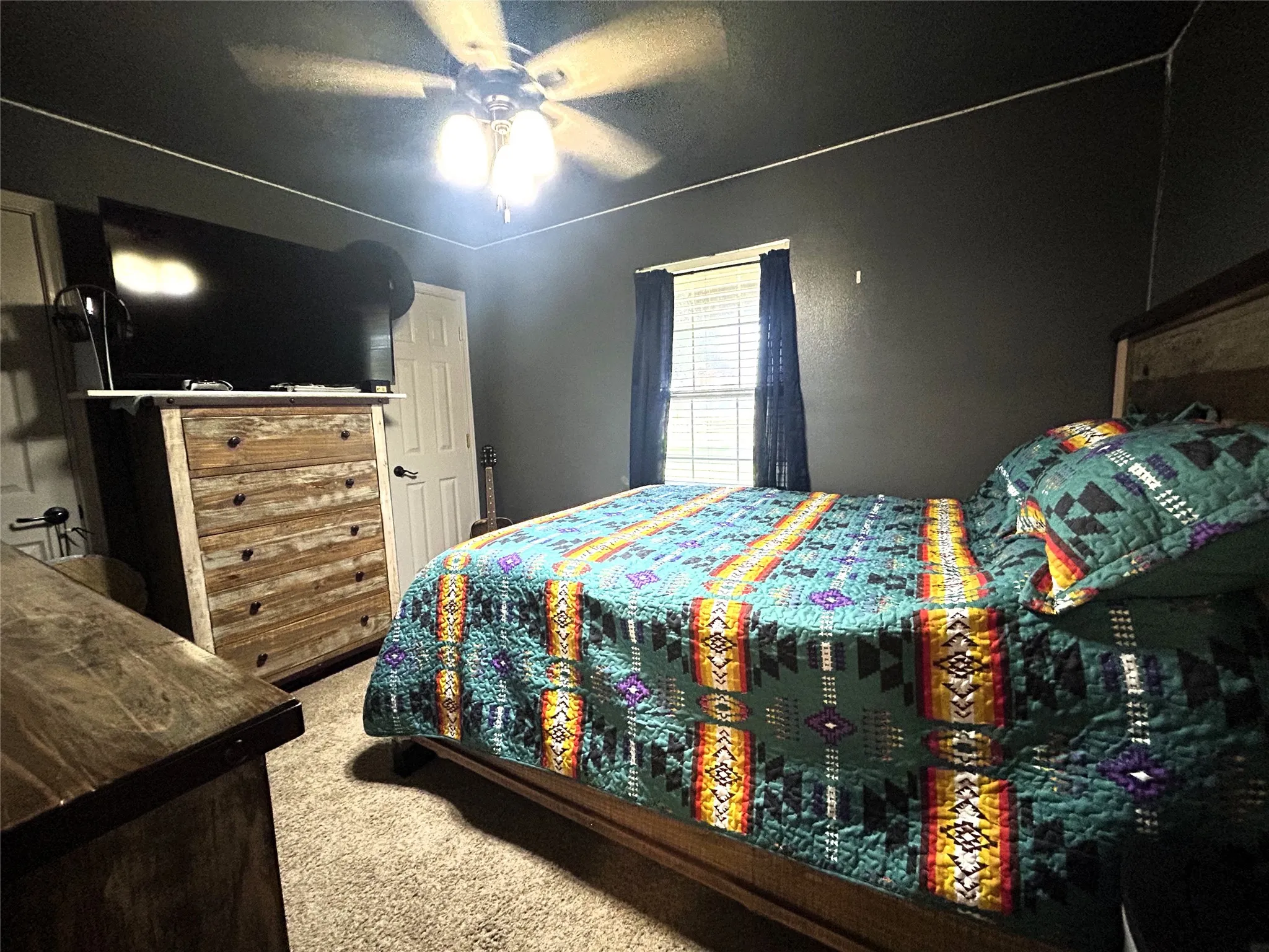 large closet and ceiling fan