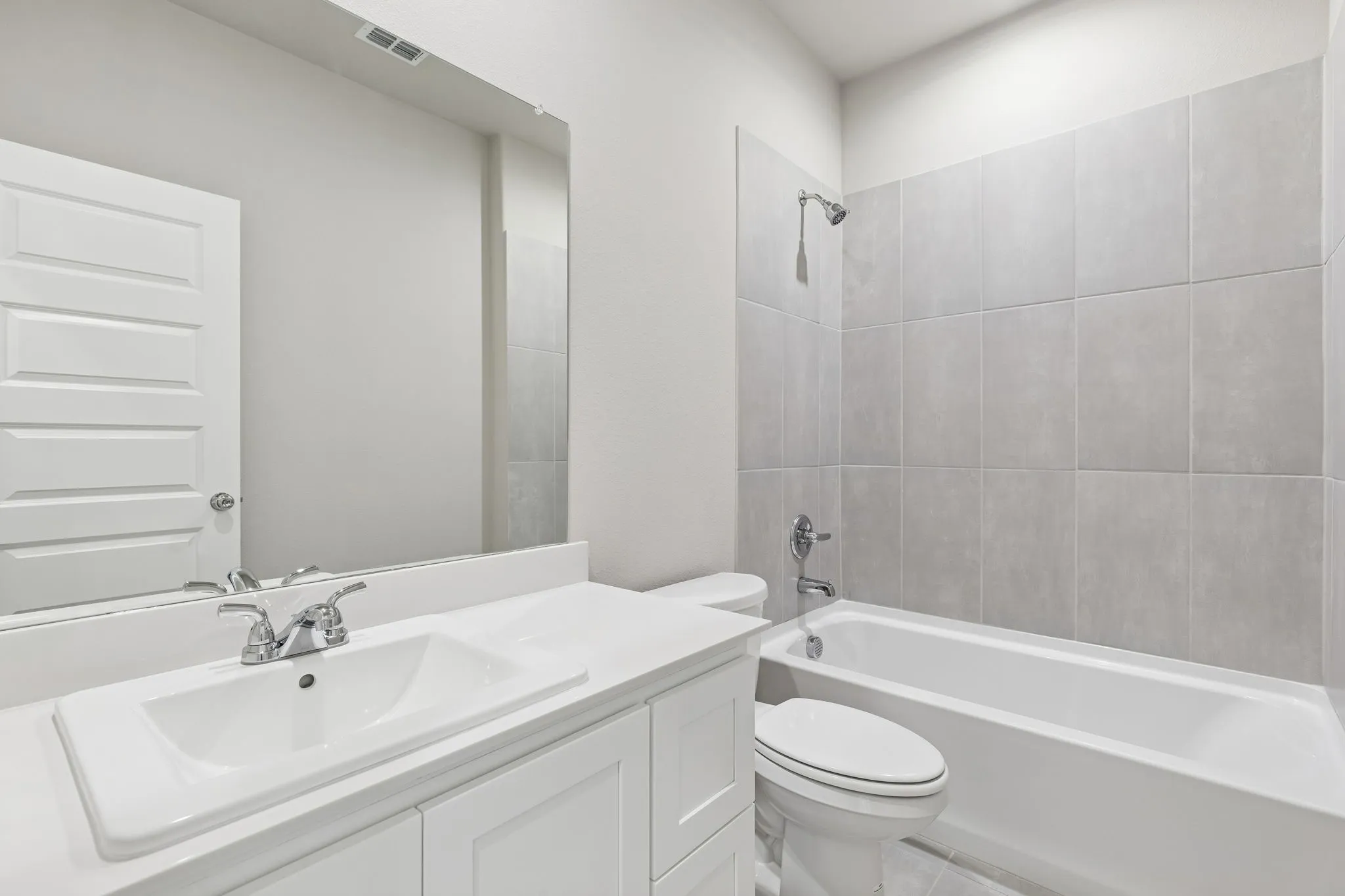 Bathroom in the Holden home plan by Trophy Signature Homes – REPRESENTATIVE PHOTO