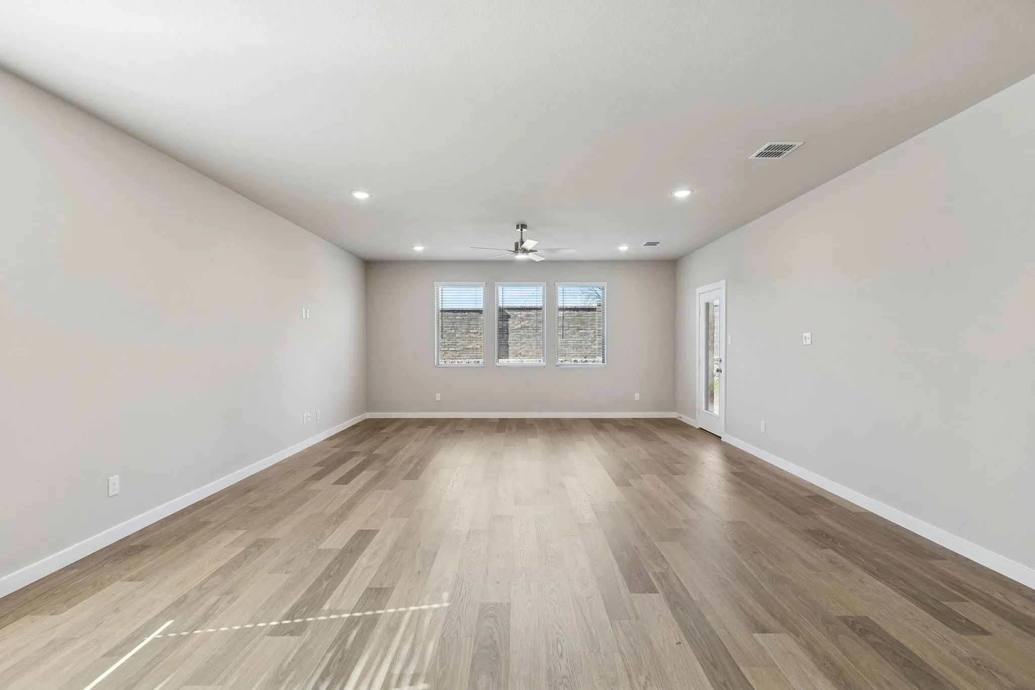 Living and Dining Room in the Holden home plan by Trophy Signature Homes – REPRESENTATIVE PHOTO