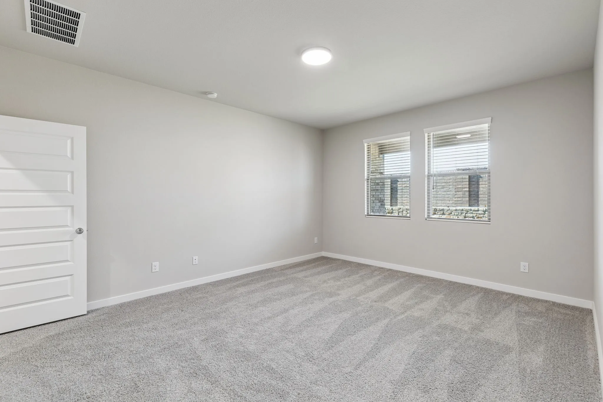 Primary Suite in the Holden home plan by Trophy Signature Homes – REPRESENTATIVE PHOTO