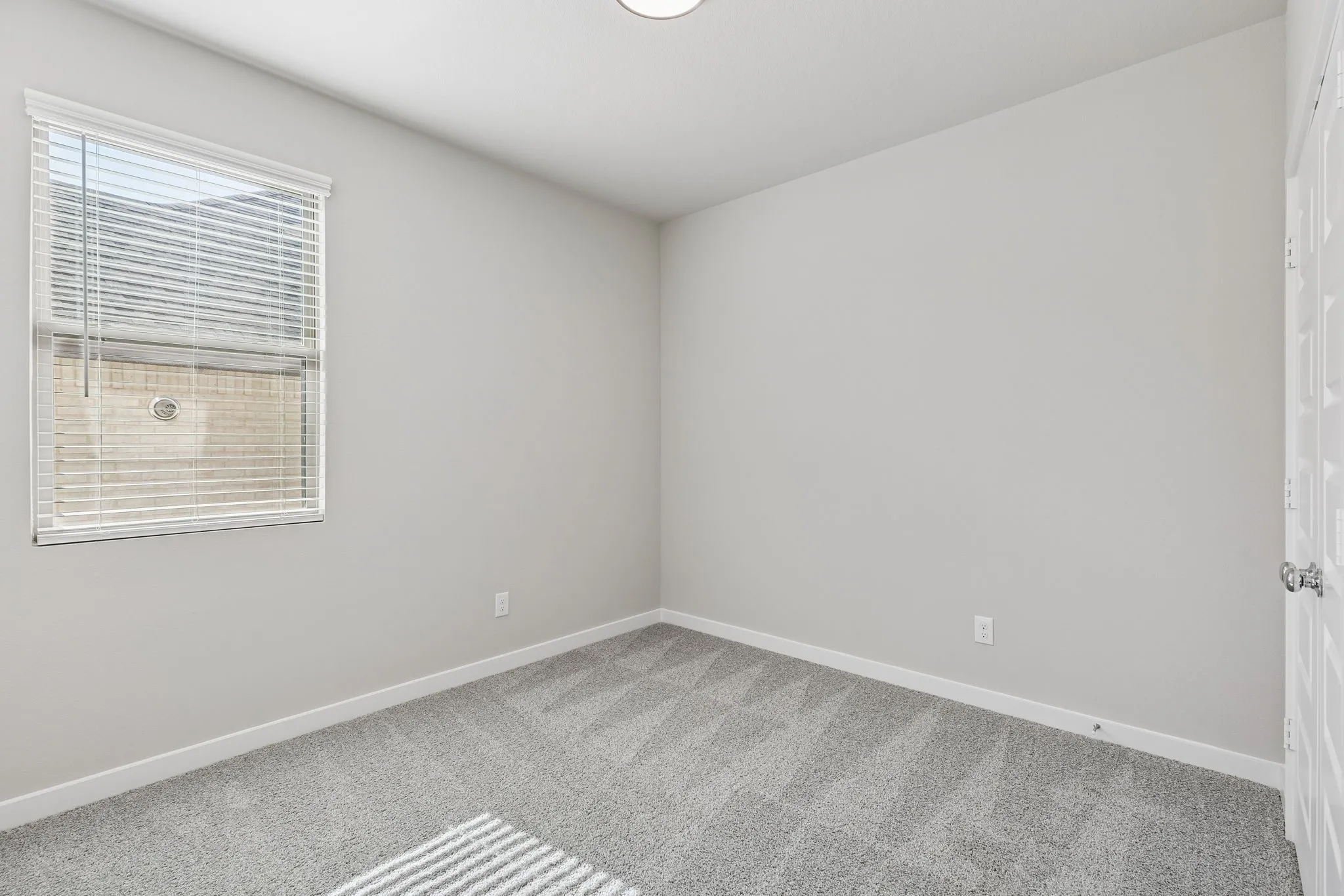 Bedroom in the Holden home plan by Trophy Signature Homes – REPRESENTATIVE PHOTO