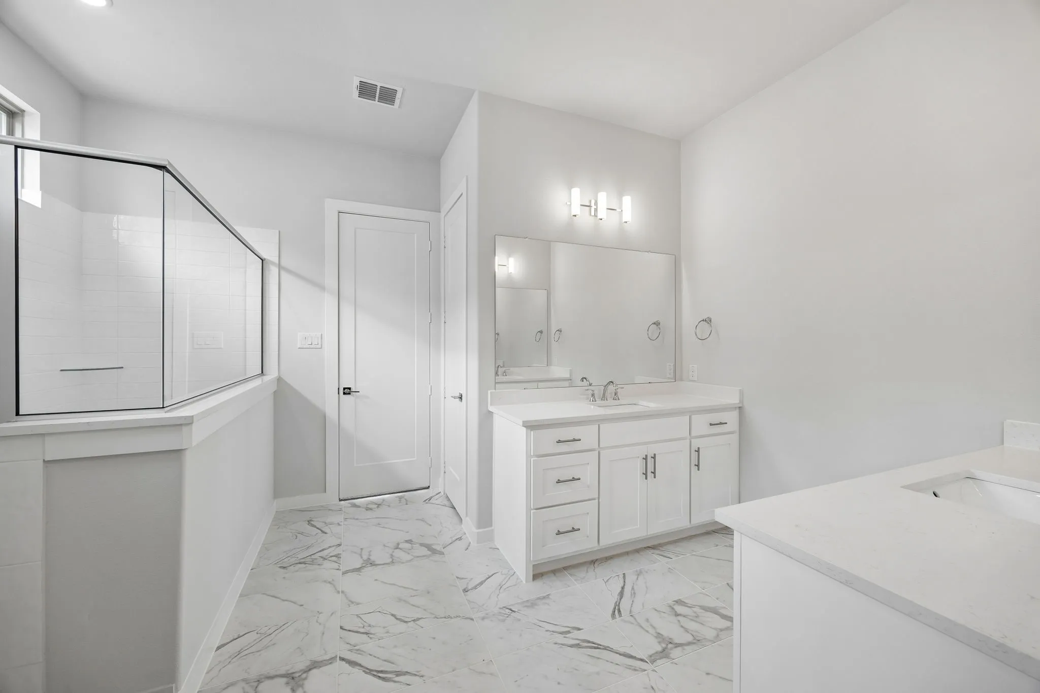Primary Bathroom in the Picasso II home plan by Trophy Signature Homes – REPRESENTATIVE PHOTO