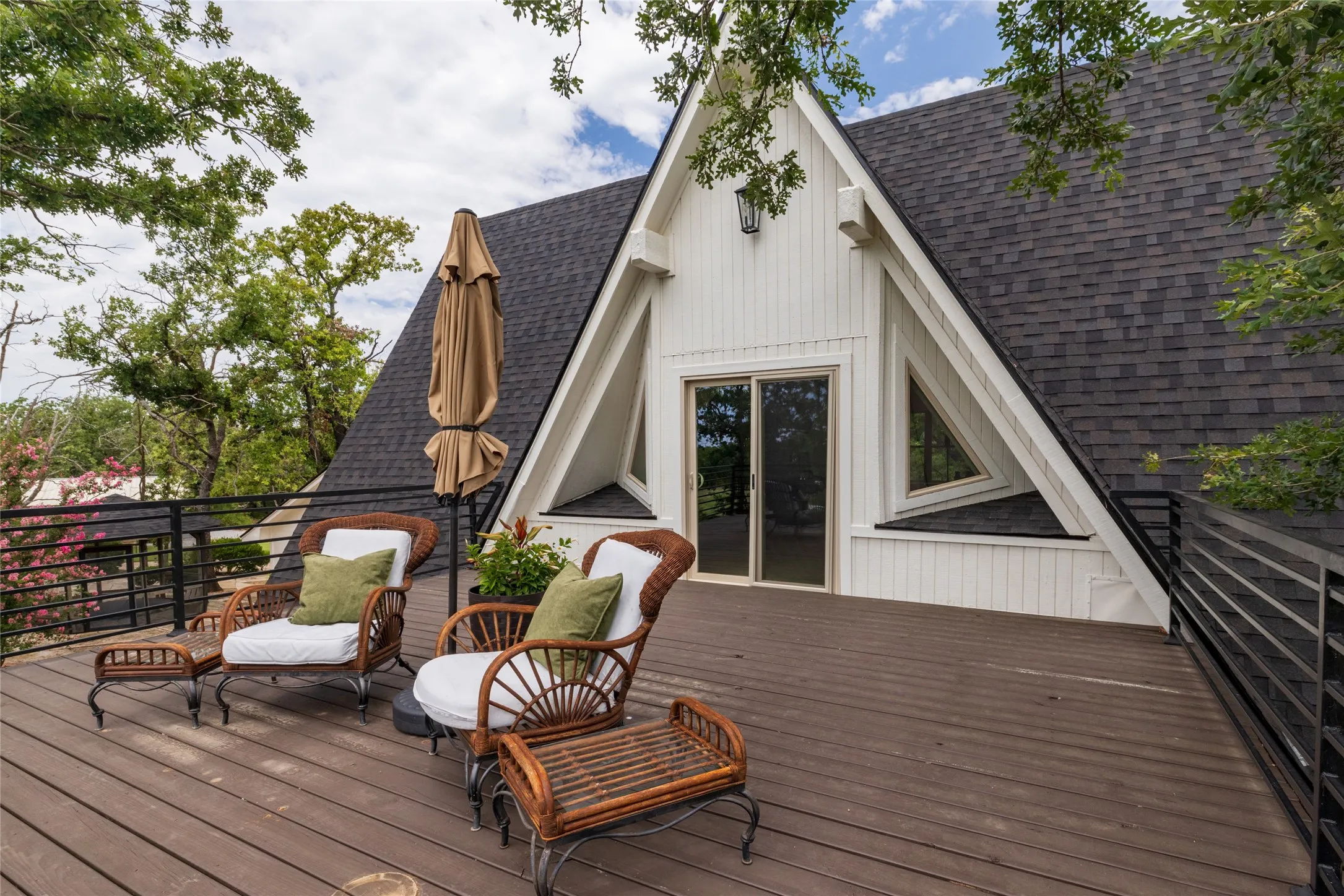 The roof top deck is surrounded by trees and faces southeast for morning coffee or peaceful evenings.
