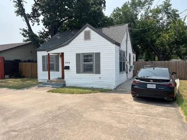 White siding exterior with gray shutters