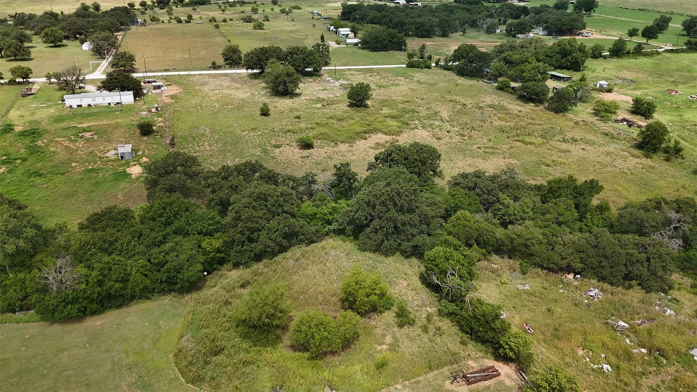 Expansive aerial showcasing a significant land parcel with varied topography