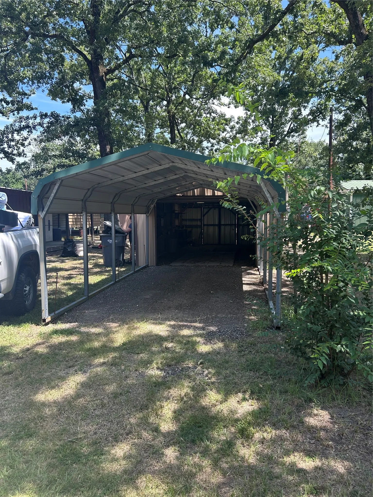 Garage and carport at front of property.