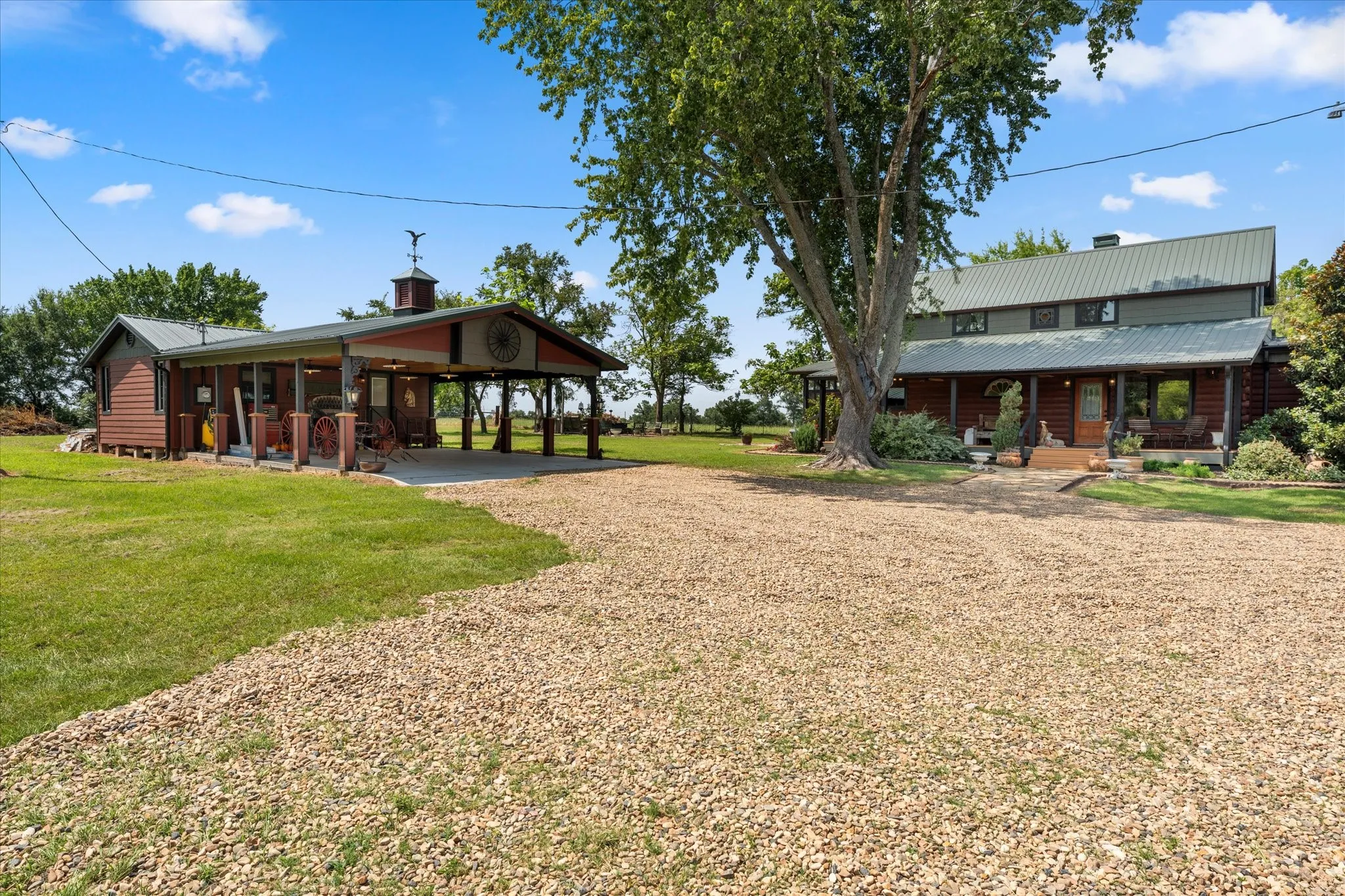 View from driveway showing carriage house and main entry