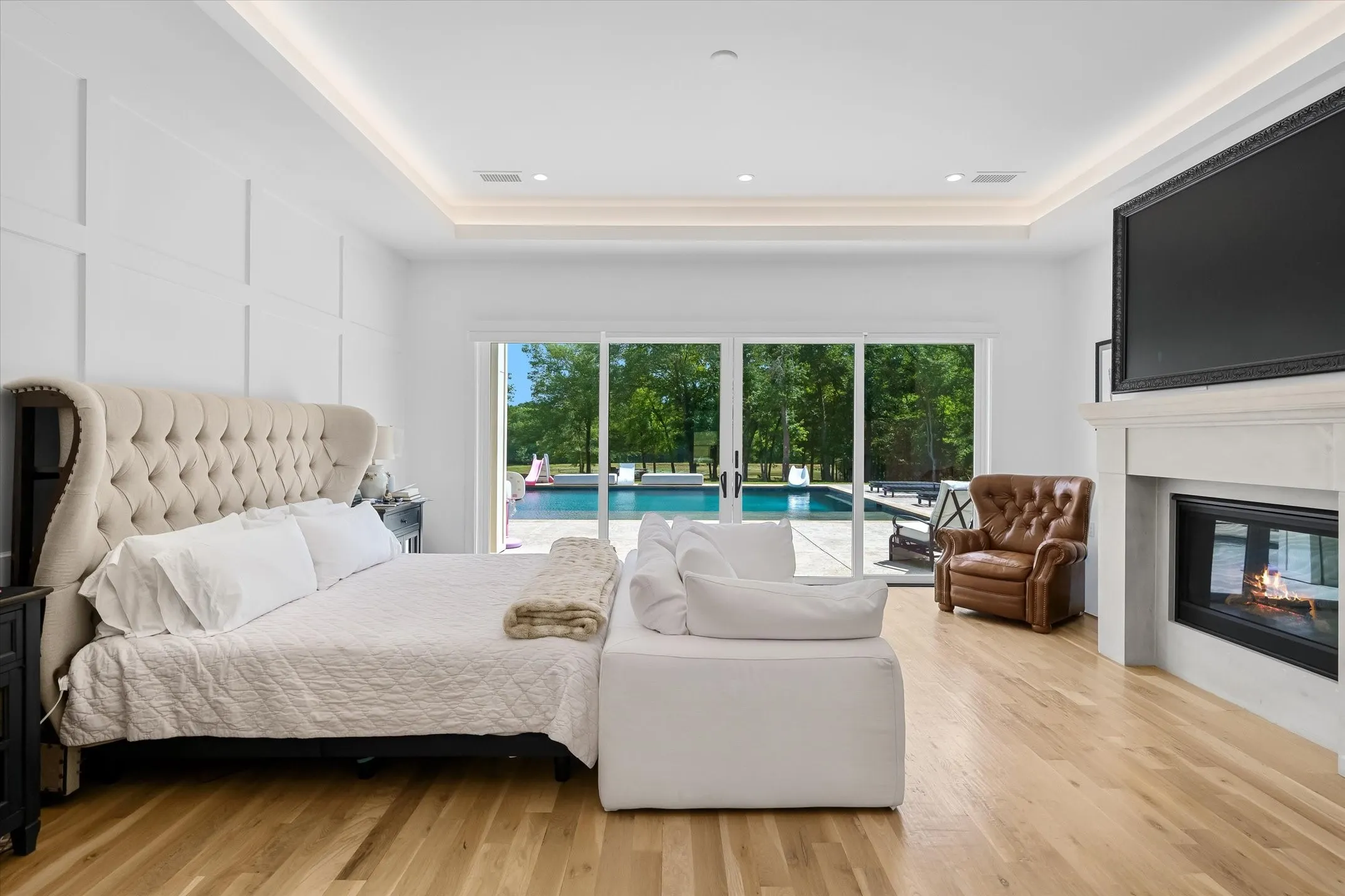 Light wood-finish flooring complements a neutral color palette