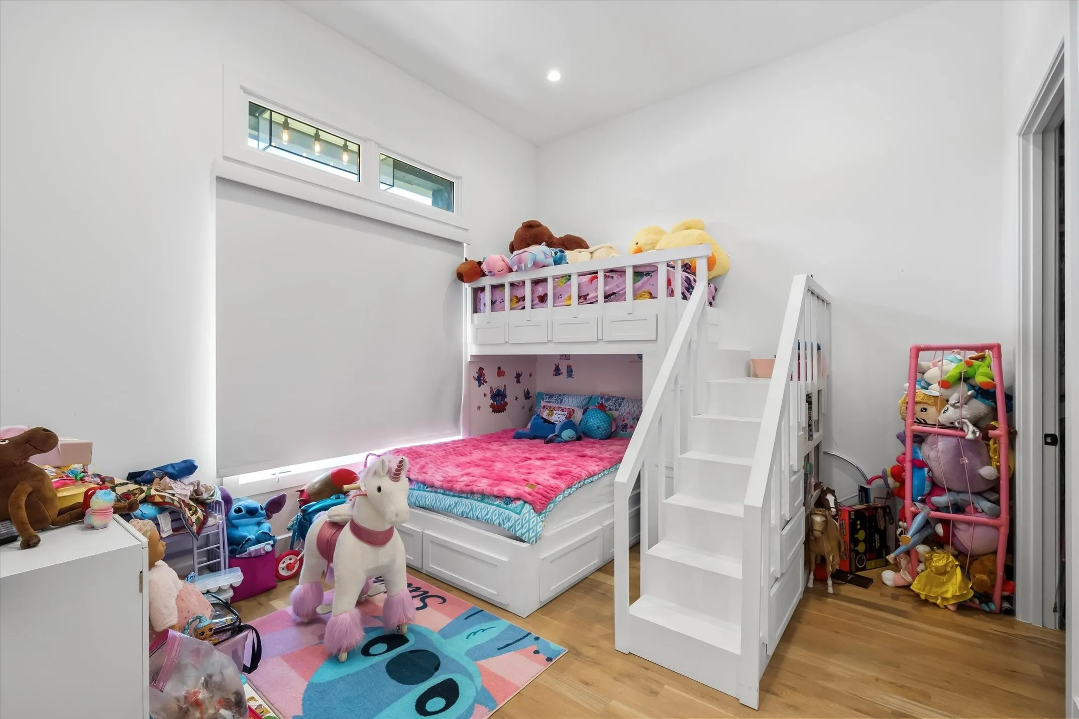 Room featuring light wood-finish flooring and white walls