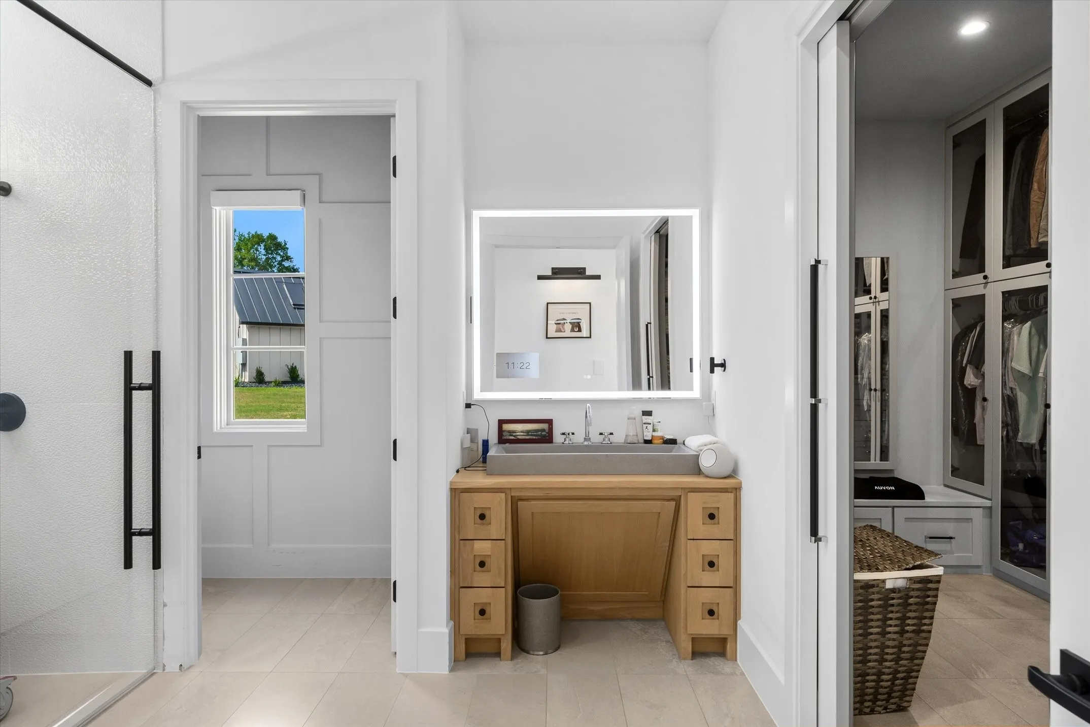 Integrated vanity with wood-finish cabinetry and a rectangular vessel sink