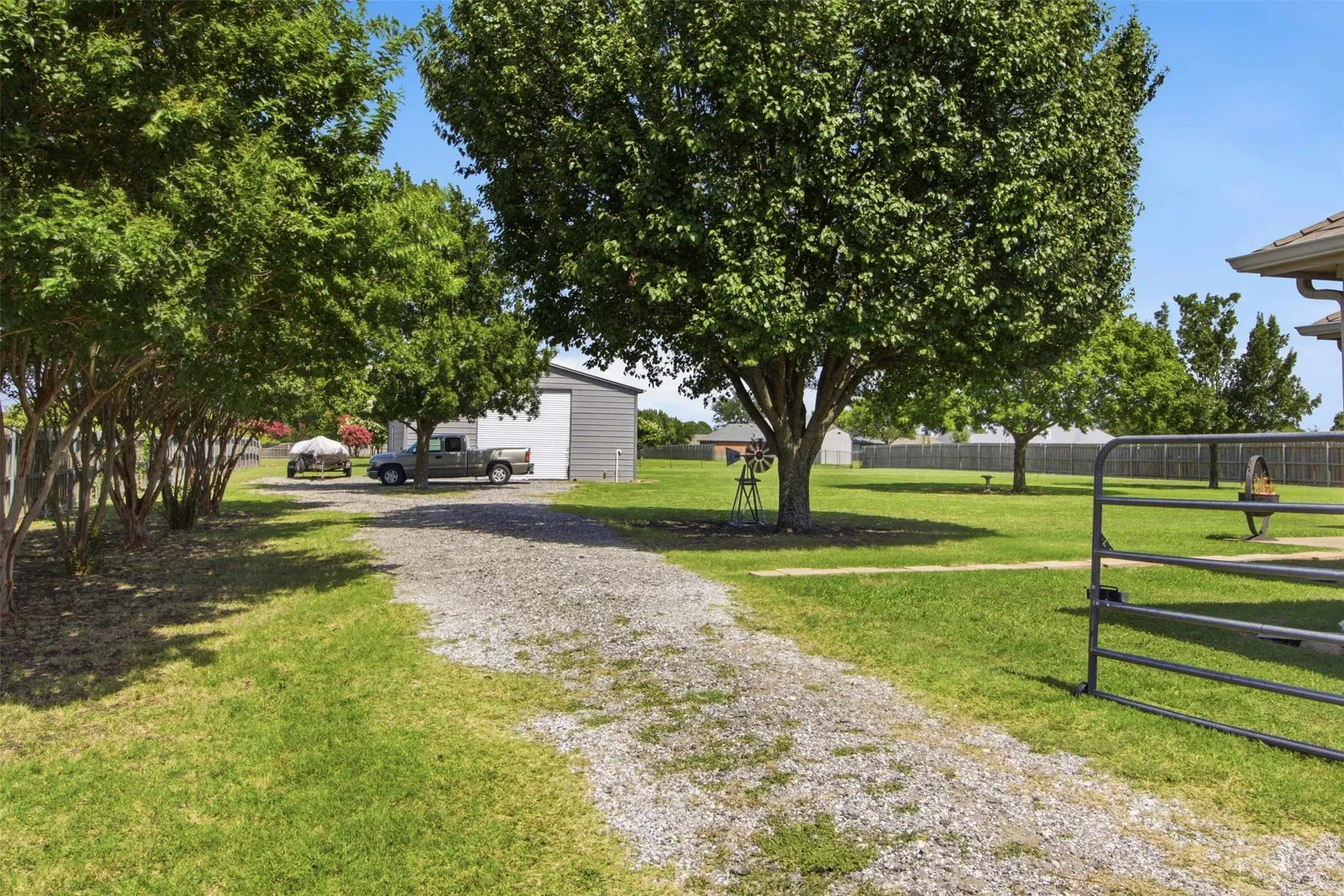Gravel driveway leading to ADU