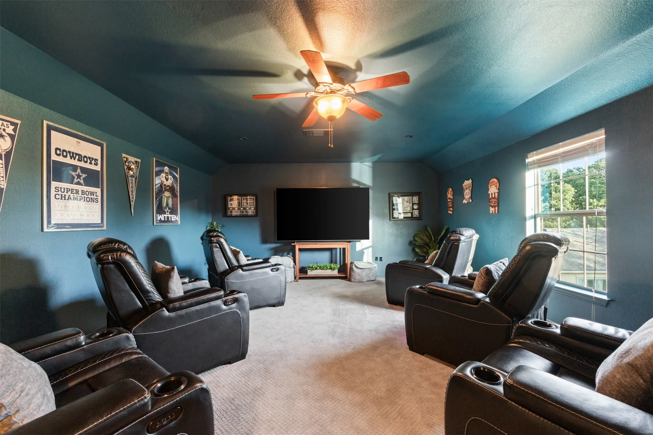 Media room is located up the stairs off of the kitchen.