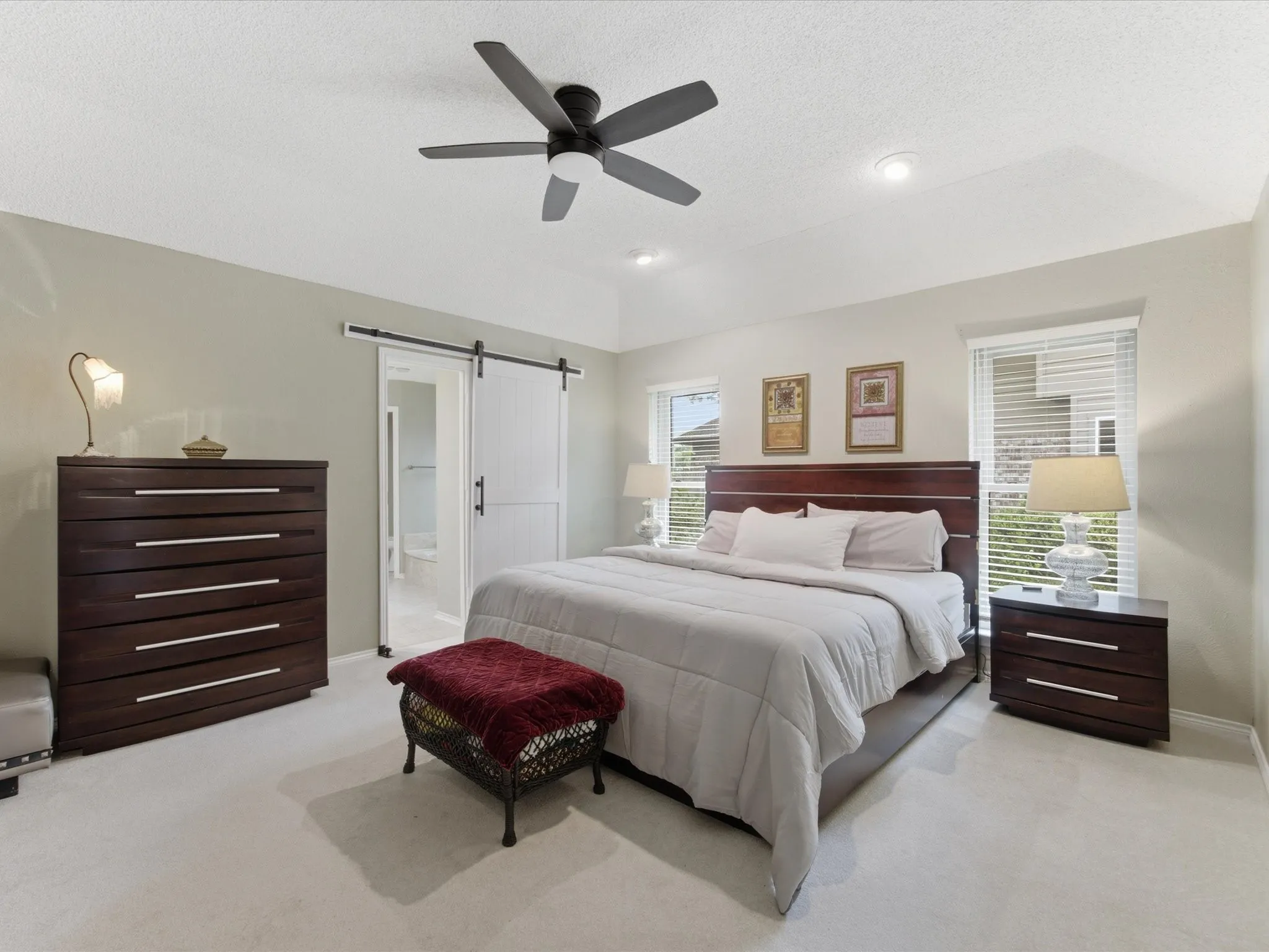 Primary Bedroom featuring vaulted ceilings, recessed lighting, a modern ceiling fan, and light-colored carpeting