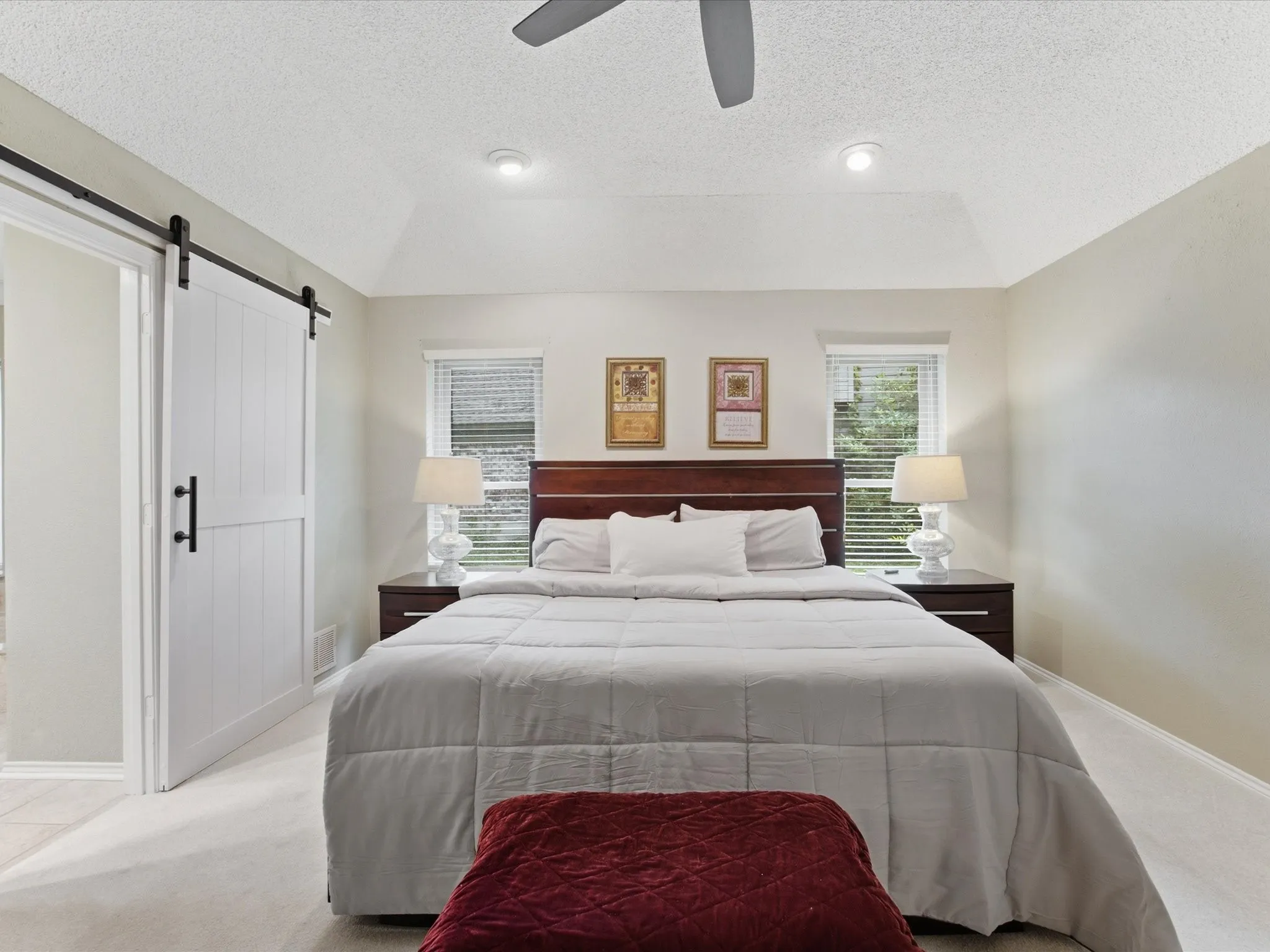 Primary Bedroom featuring vaulted ceiling with recessed lighting and ceiling fan