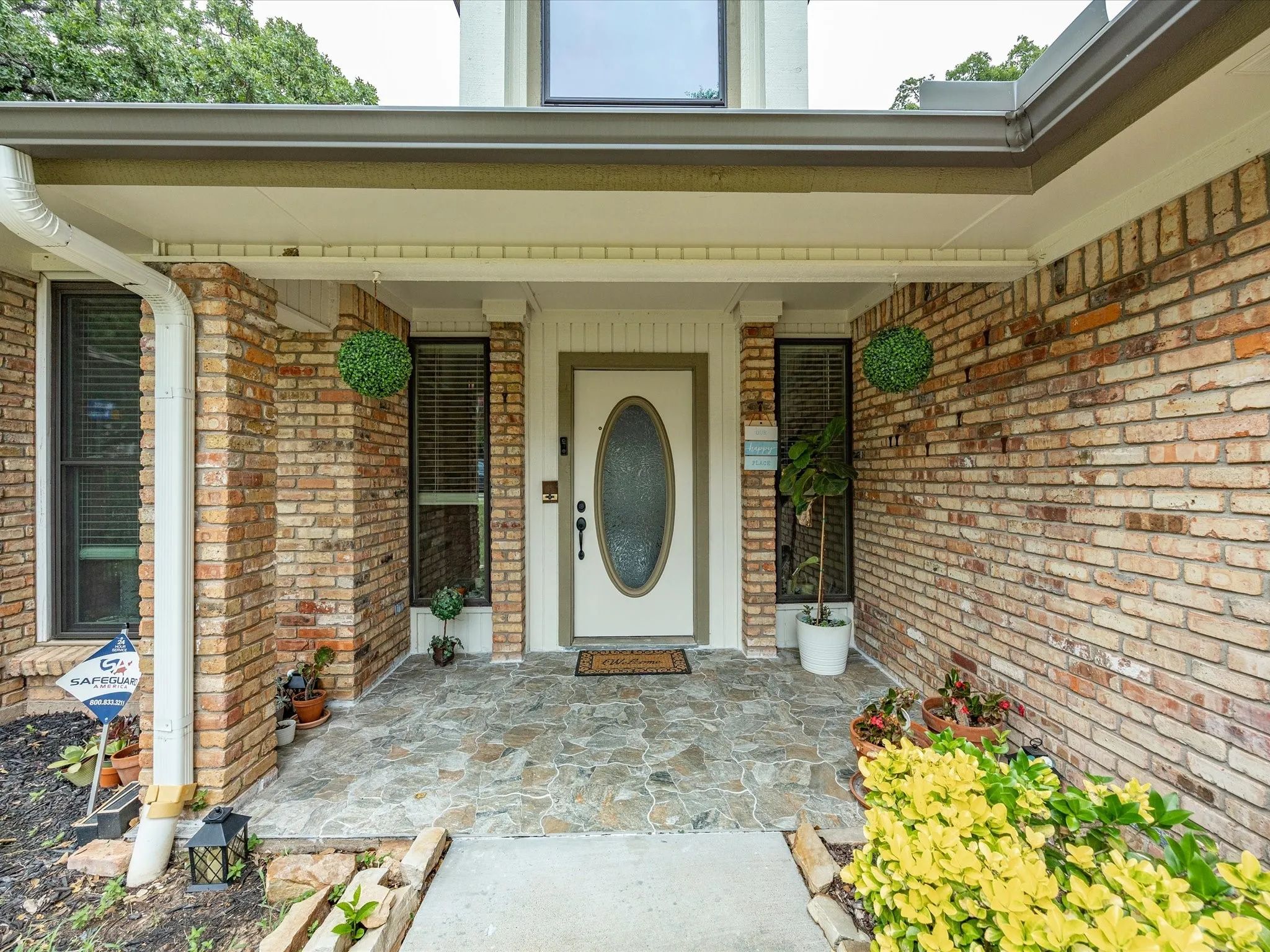 Brick exterior featuring a stone-paved entryway