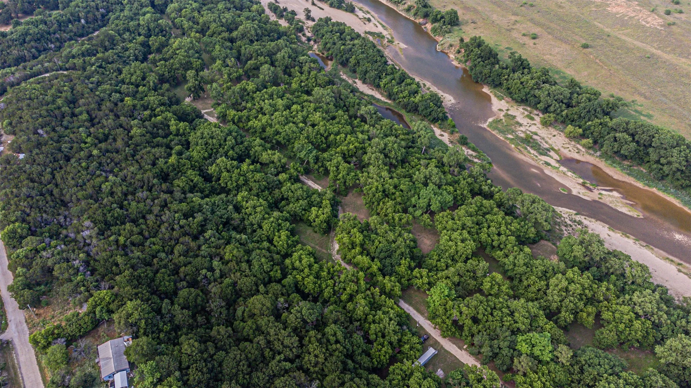 Expansive wooded acreage featuring a natural river and undeveloped land