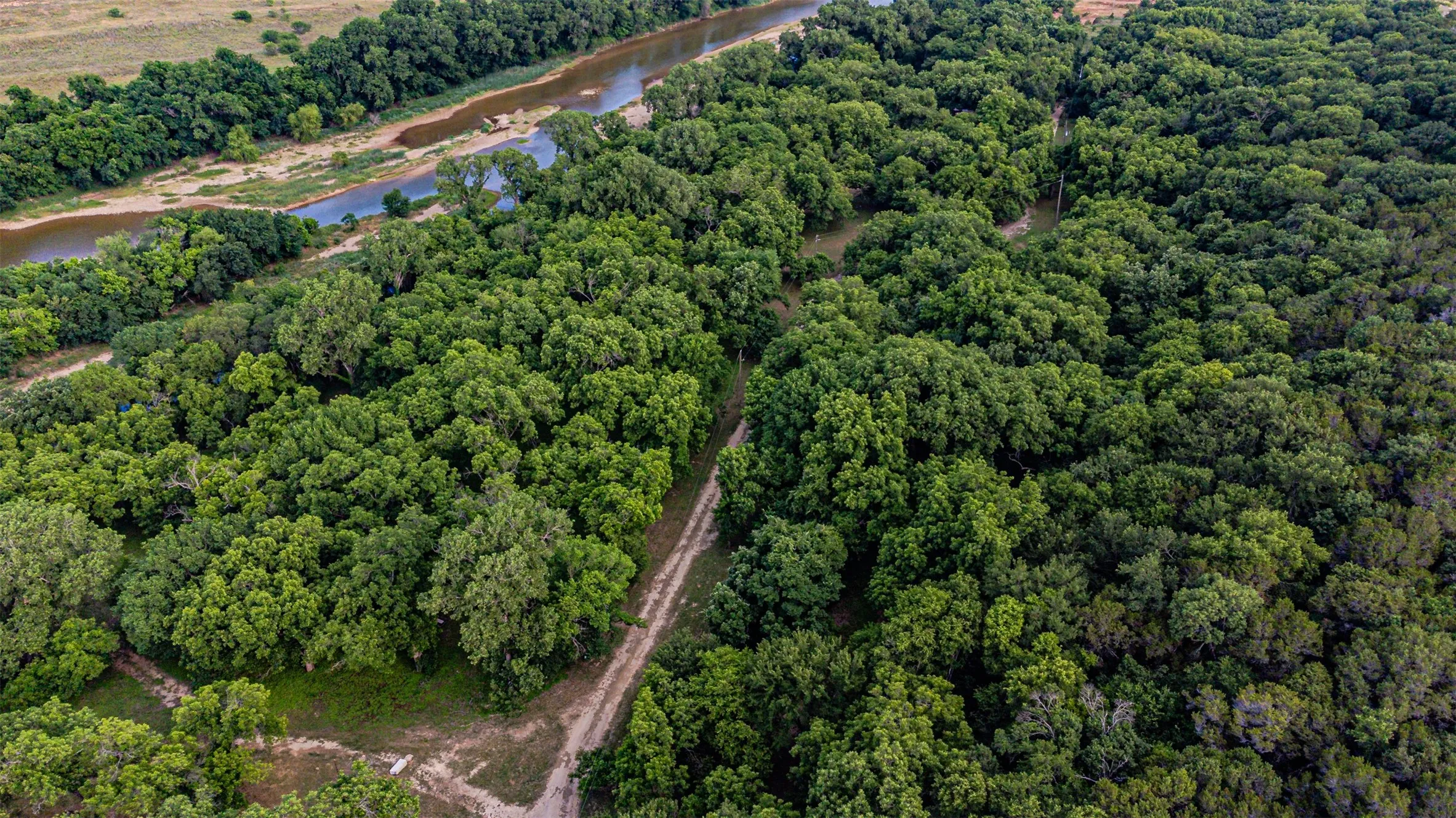 Expansive wooded acreage featuring a natural river and undeveloped land
