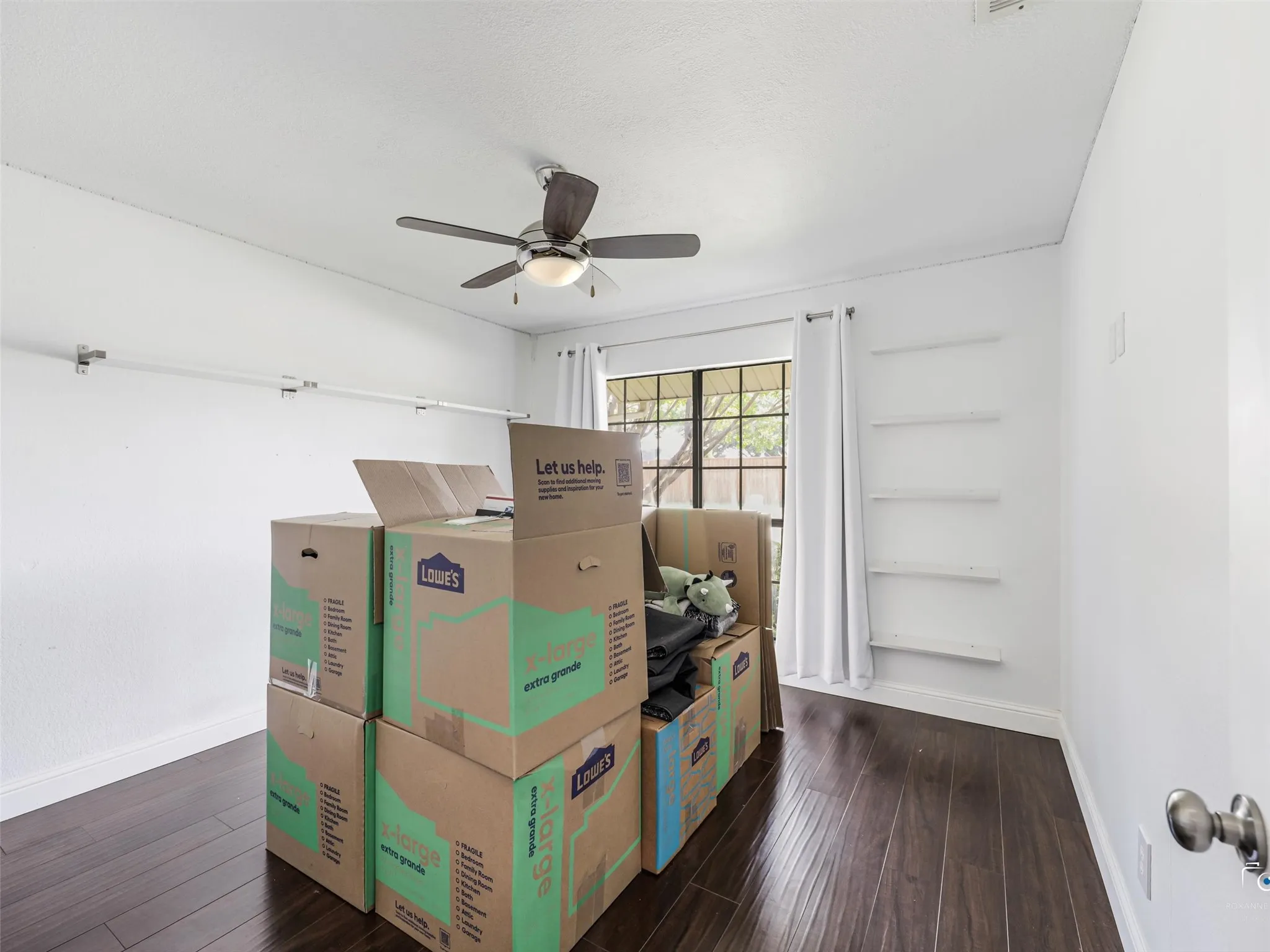 Bedroom 4 has the same wood floors and made a perfect home office for the current homeowner.  It is currently all packed up and ready to move!