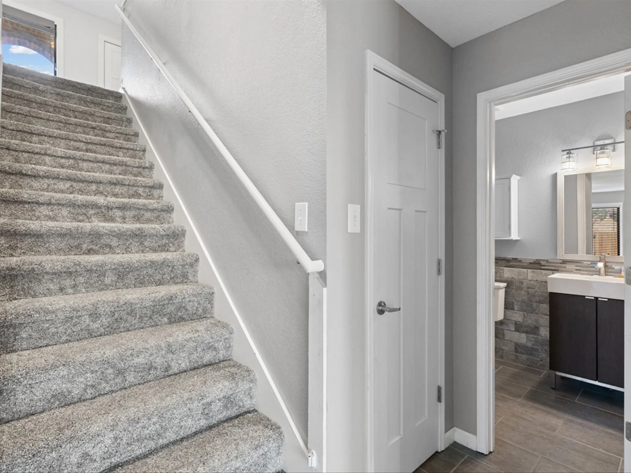 Stairs featuring plenty of natural light