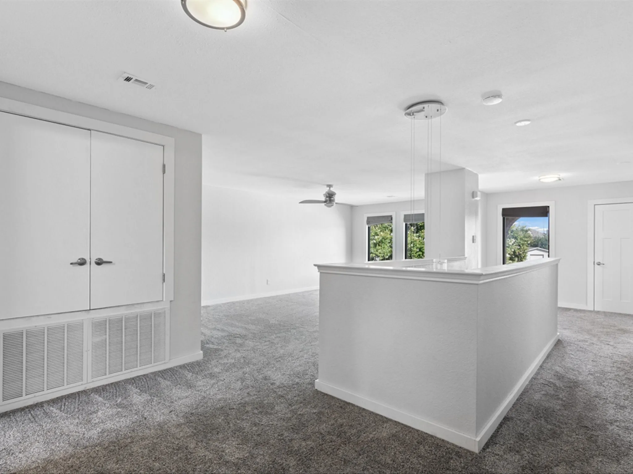 Hallway featuring carpet