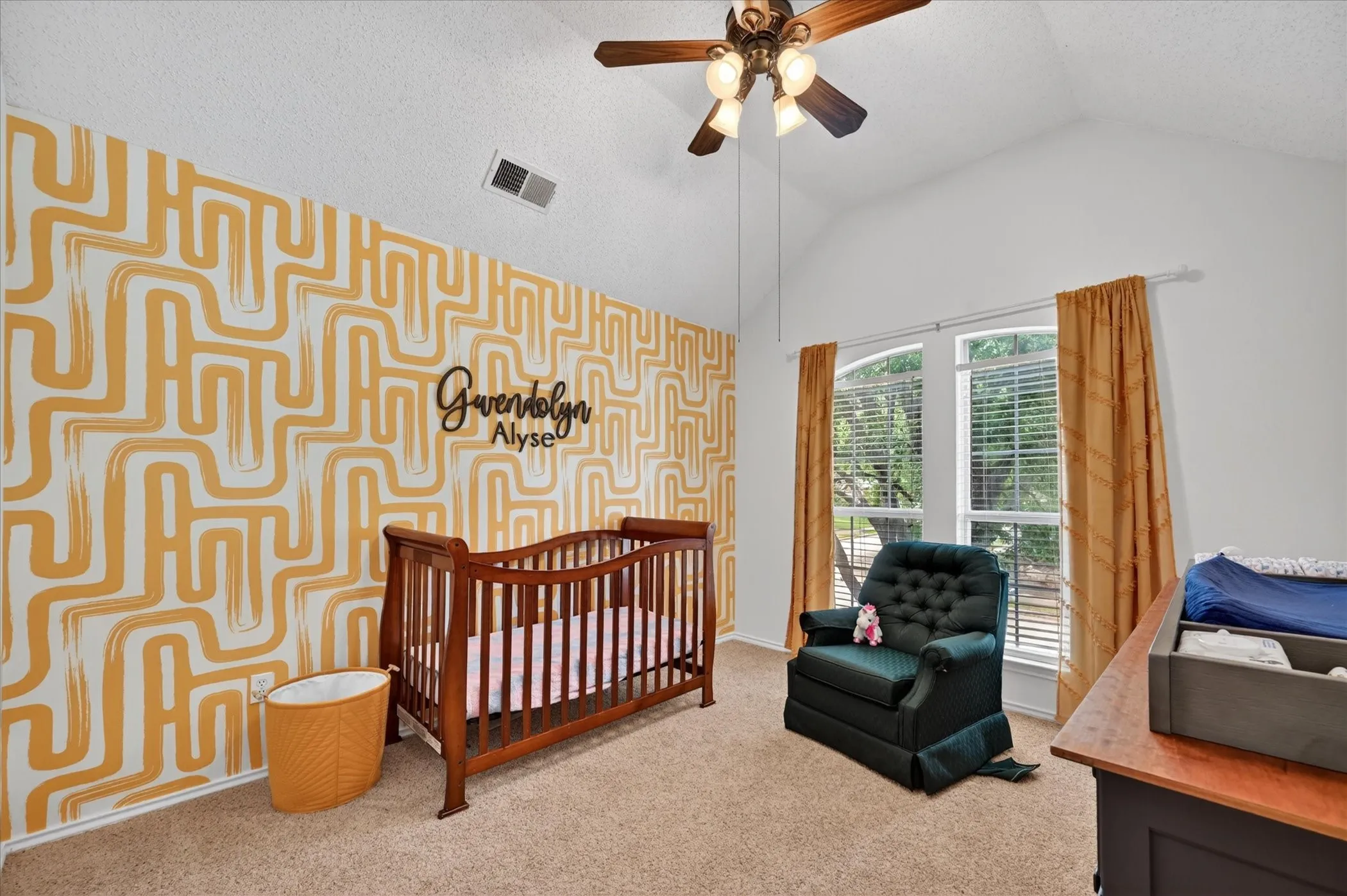 Secondary bedroom with an accent wall