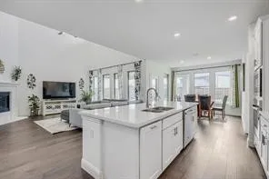Spacious kitchen island with a white countertop and undermount sink