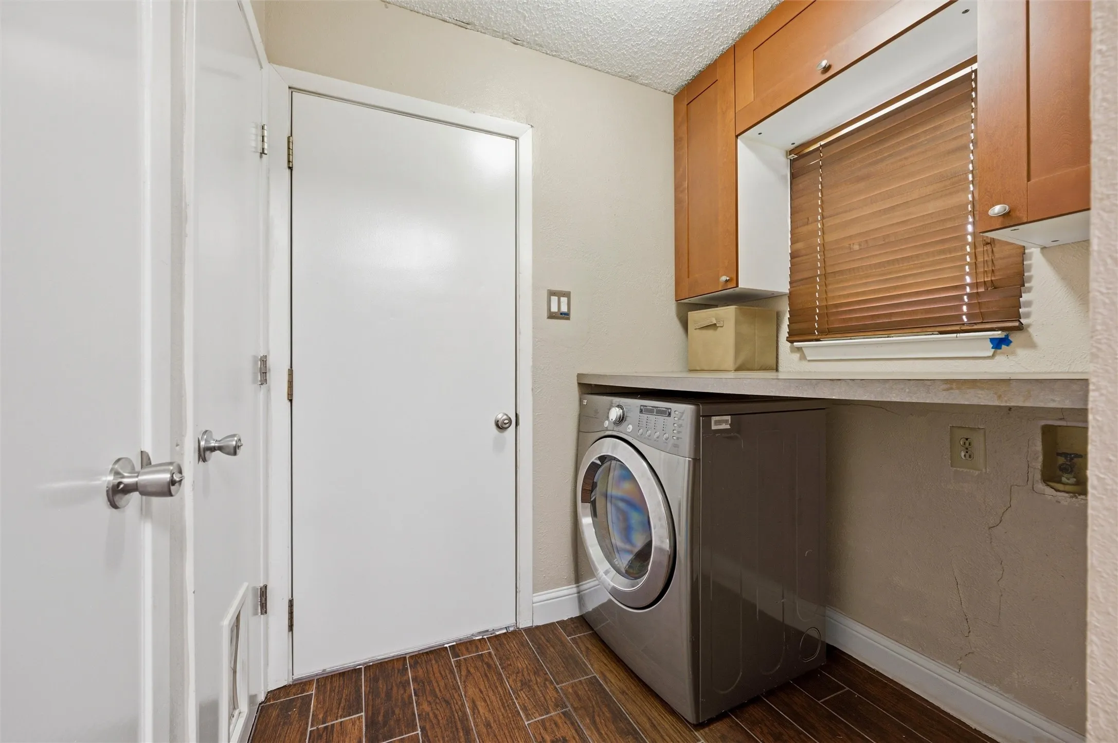 Laundry room with pantry