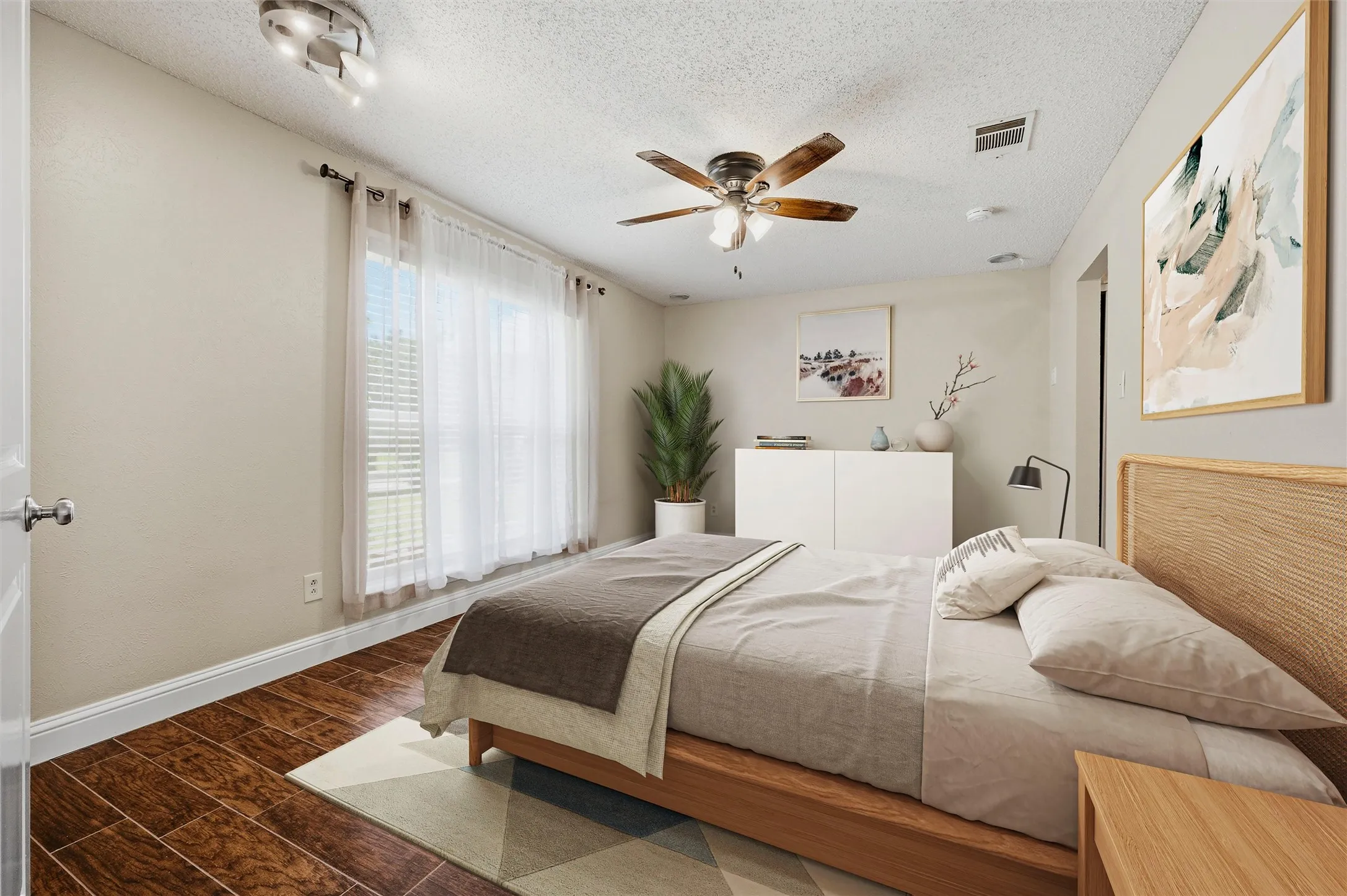 Large primary bedroom at the front of the​​‌​​​​‌​​‌‌​‌‌​​​‌‌​‌​‌​‌​​​‌​​ home.