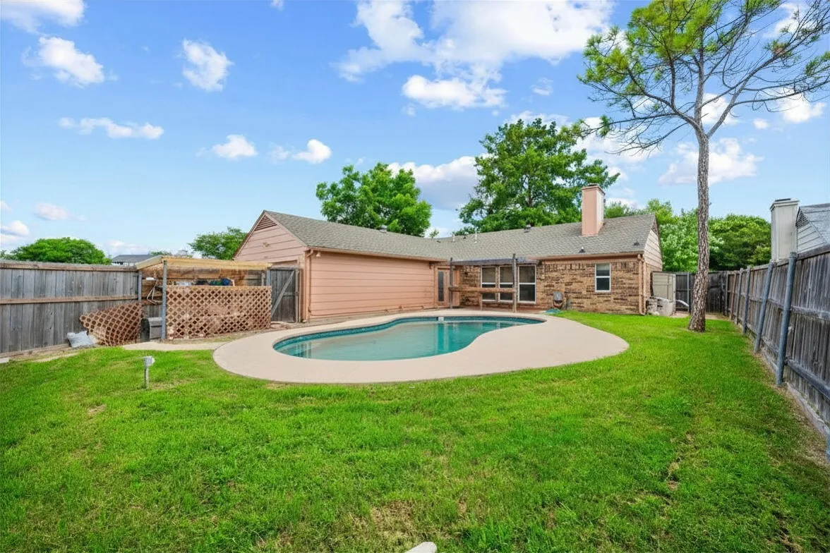 The large lot easily accommodates a pool while still providing yard space for other outdoor activities
