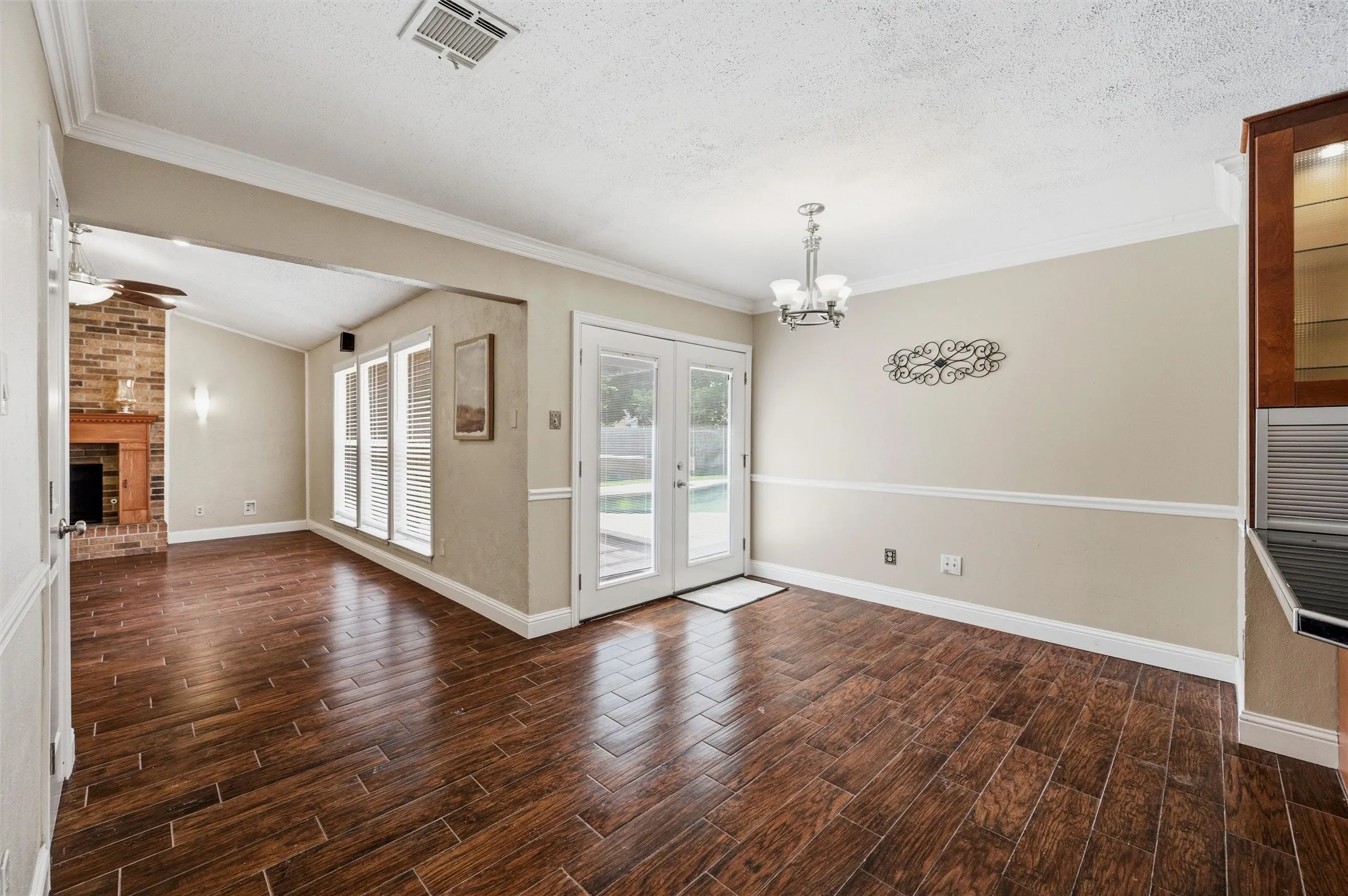 French doors lead to backyard pool!