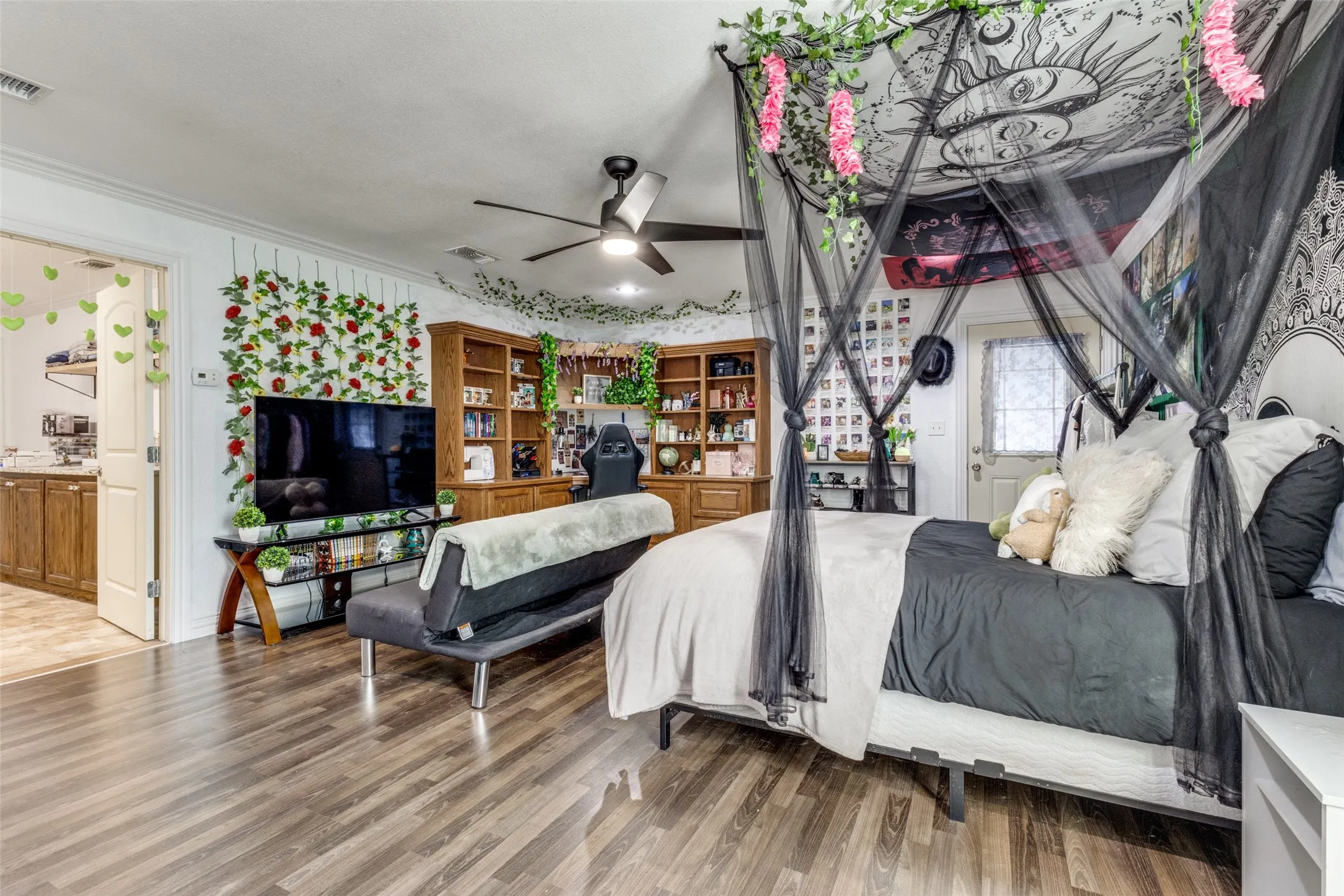 Bedroom featuring ornamental molding and light wood finished floors