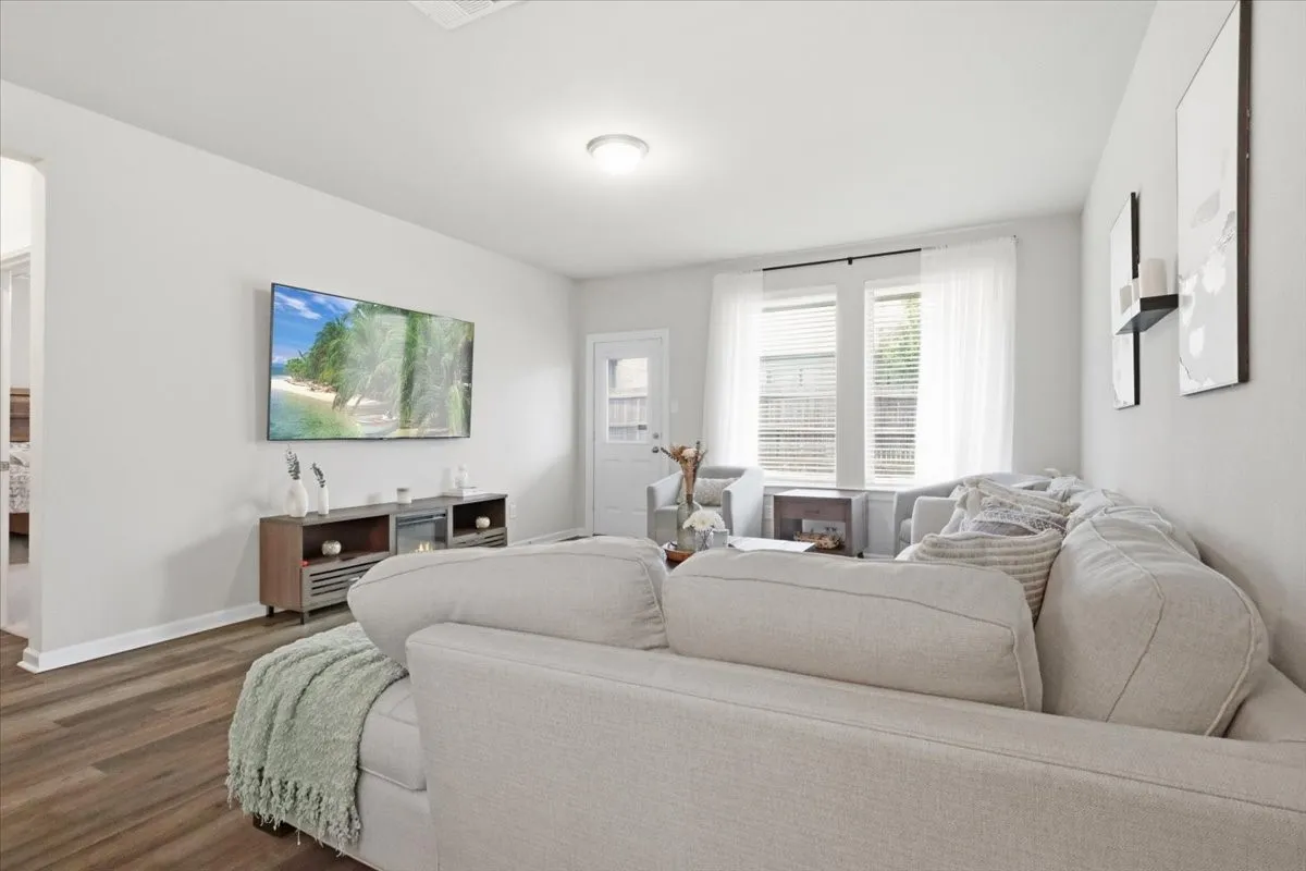 Light gray walls complement wood-finish flooring