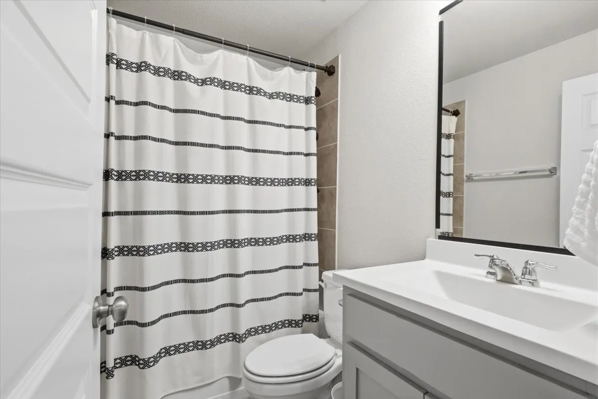 White vanity with an integrated sink and chrome faucet