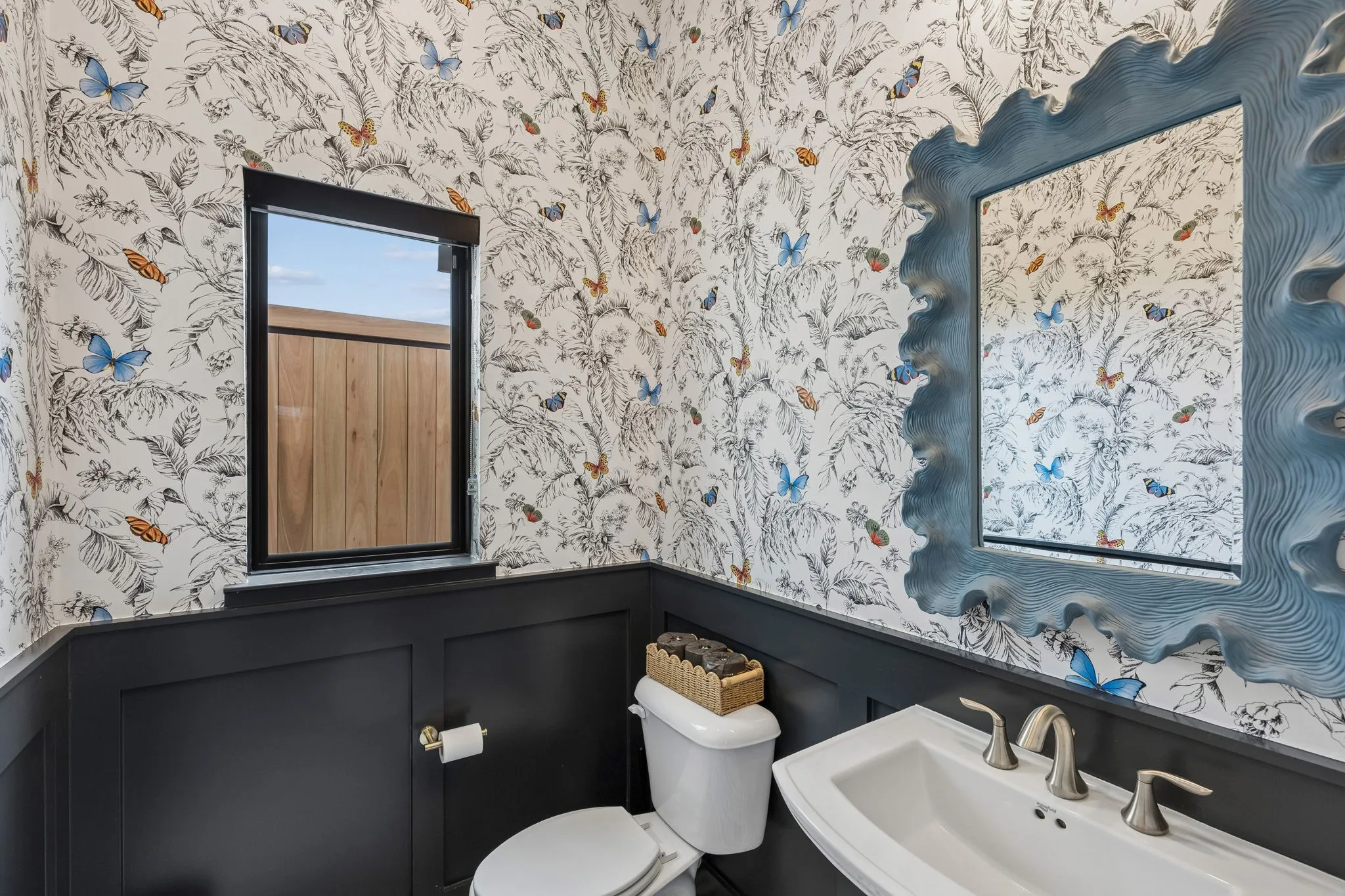 Powder bath. new wallpaper mirror and lighting