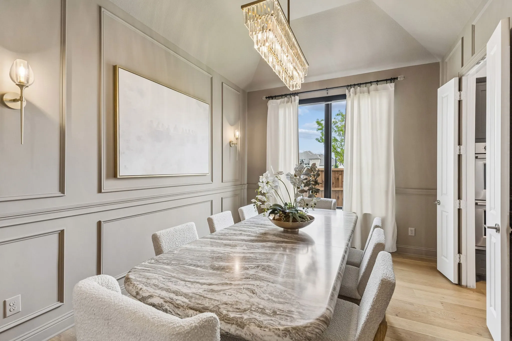 custom lighting,wainscotting & lighting in dining room
