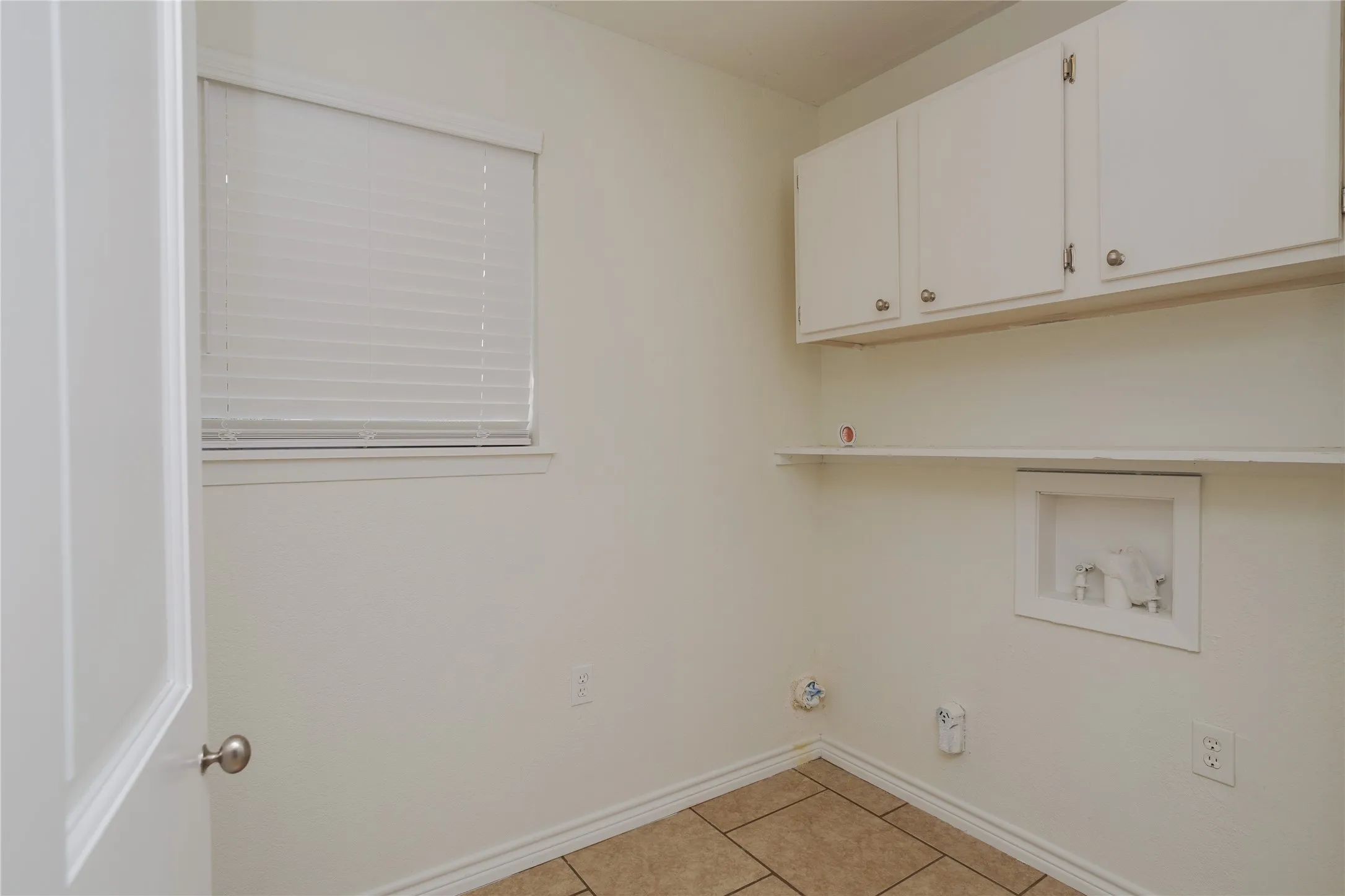 Spacious laundry room, with good storage.