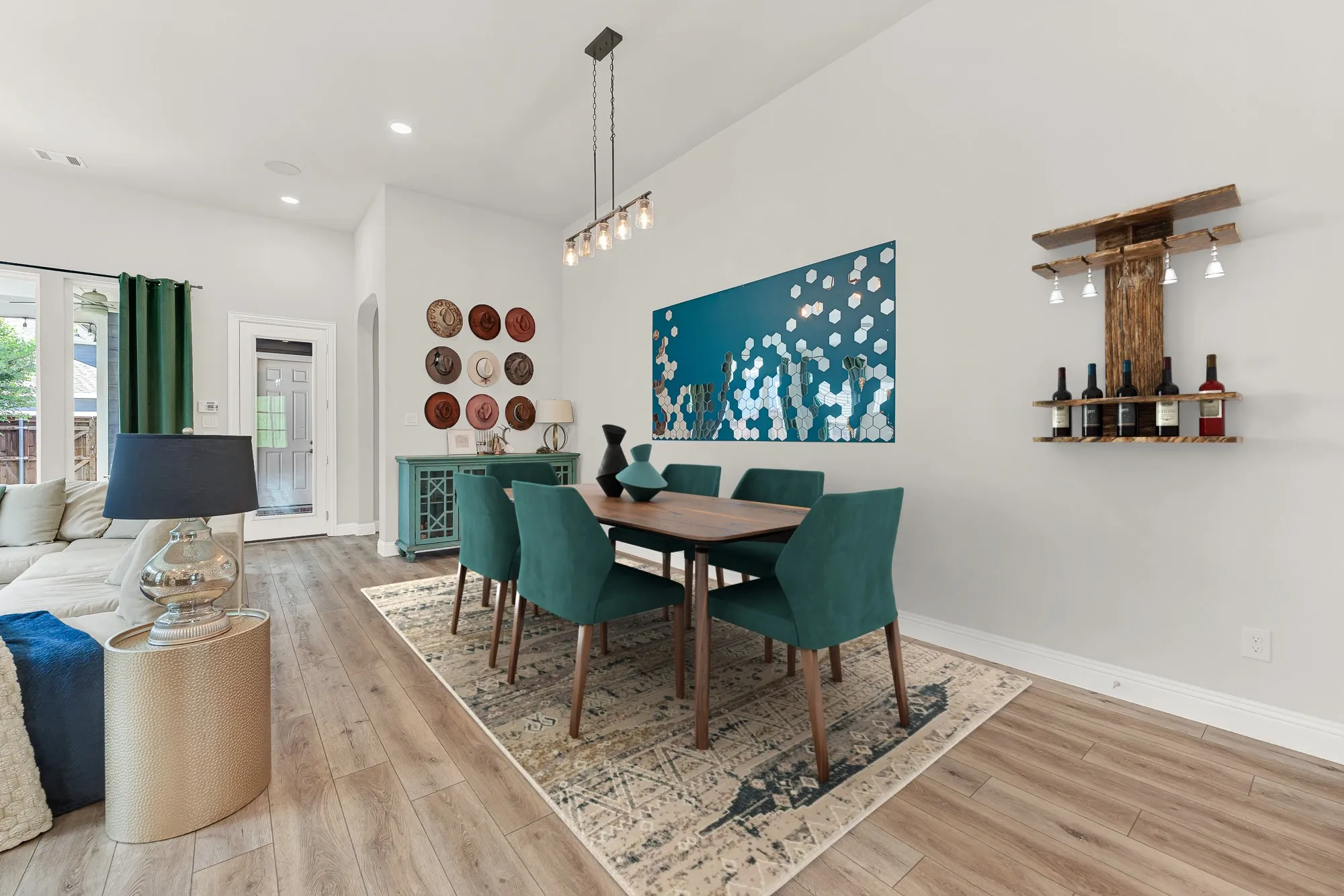Dining space with statement accent wall, open floor plan