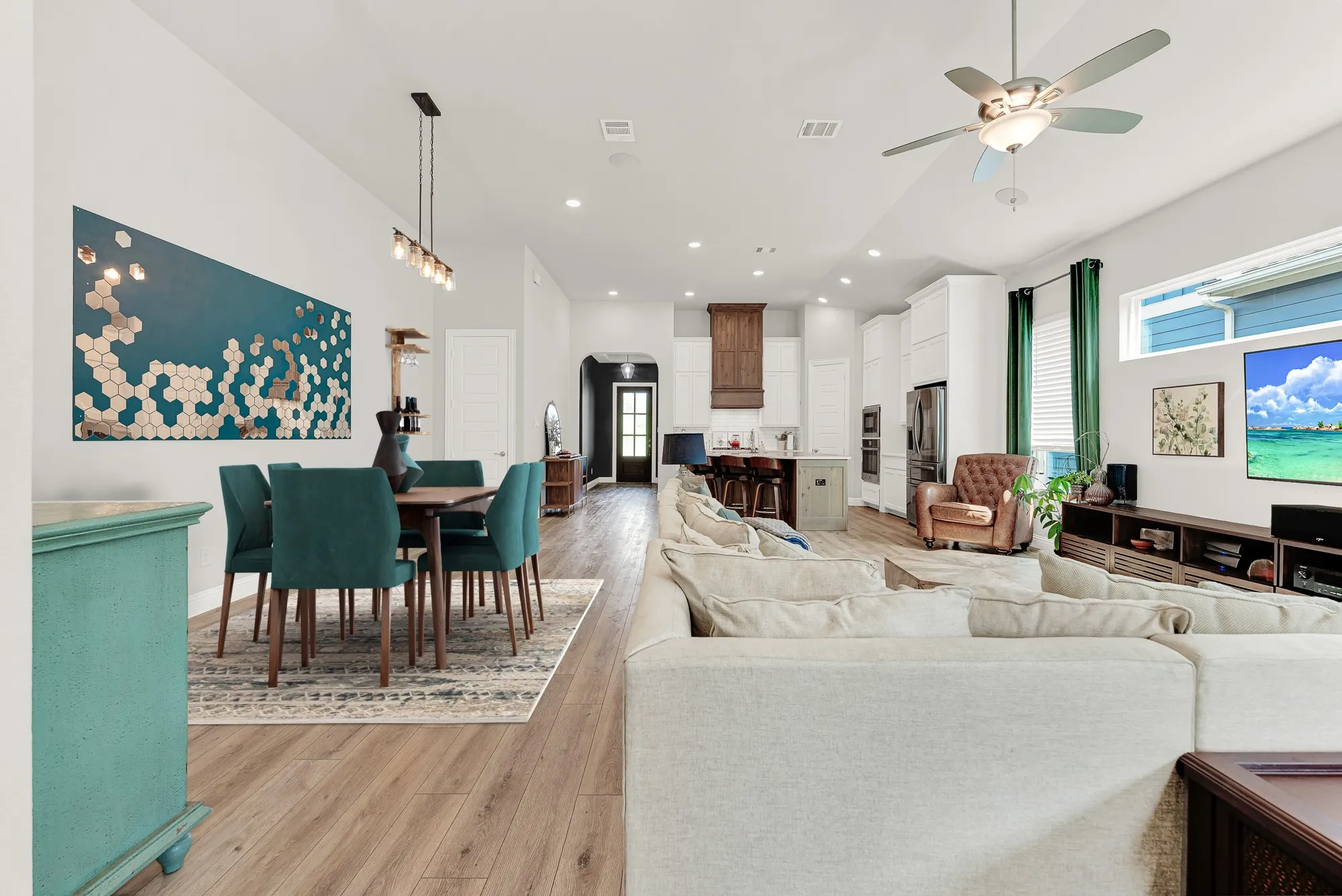 Expansive open-concept living space, 12-ft ceilings, greenspace views