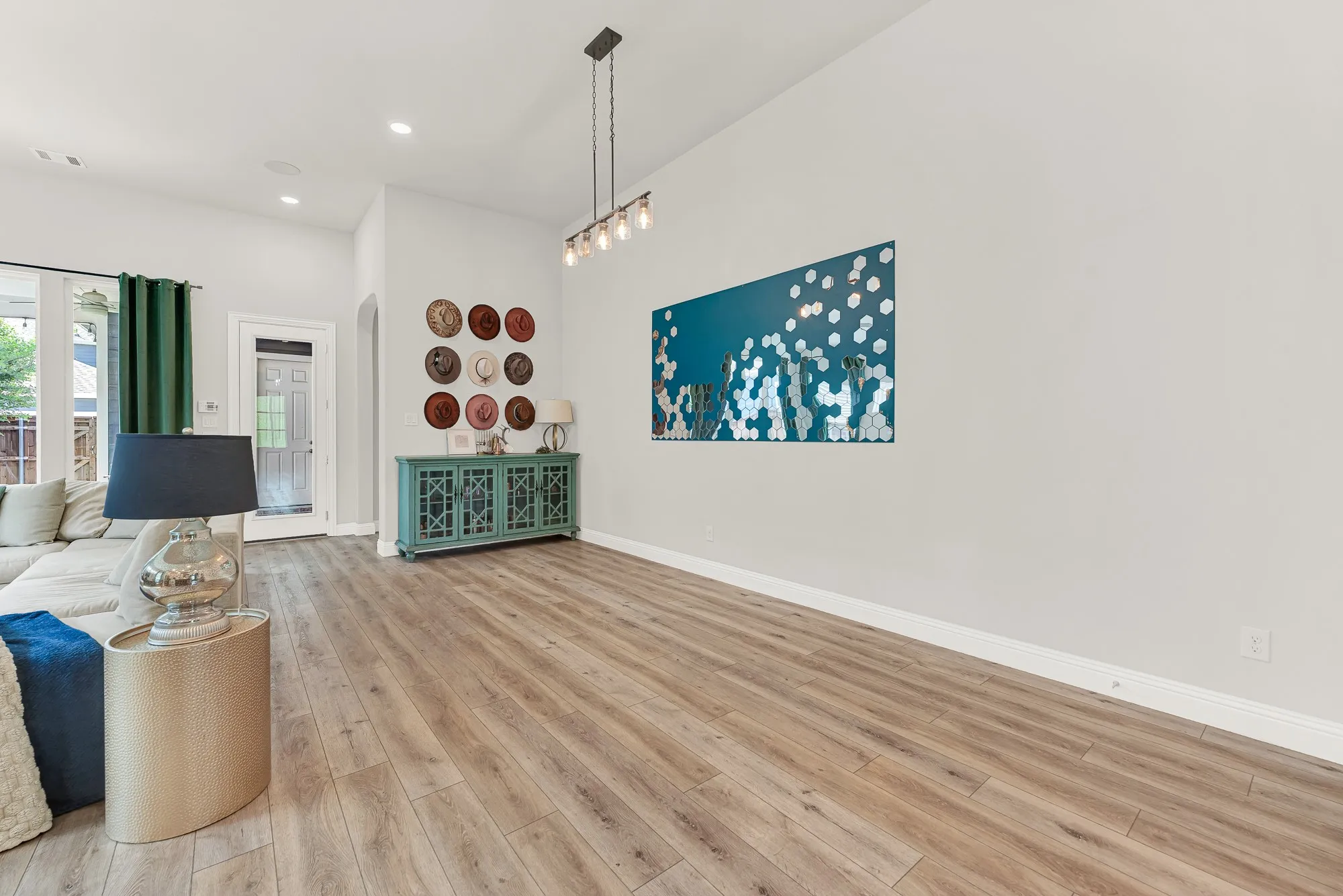 Dining space with statement accent wall, open floor plan