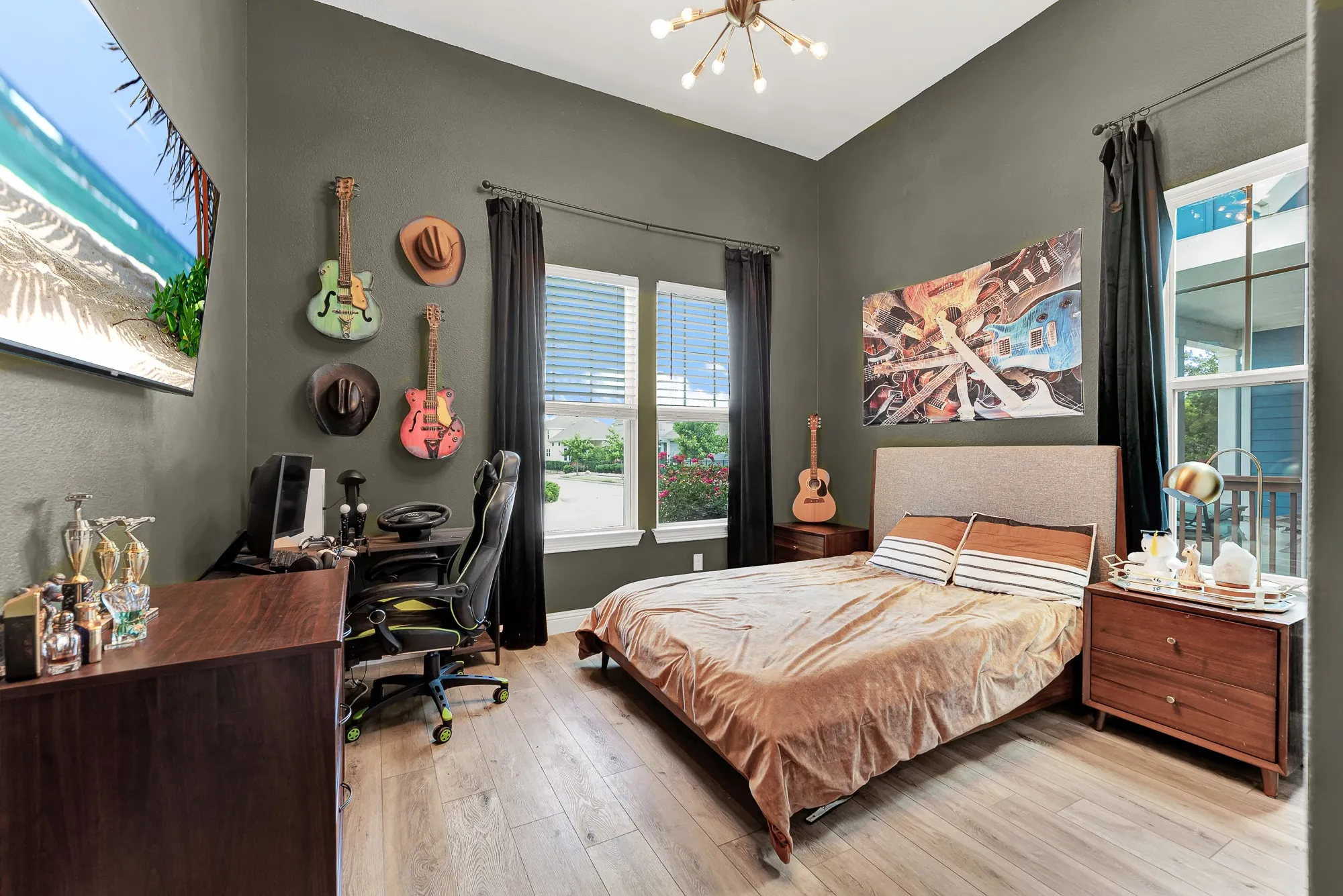 Secondary bedroom with LVP flooring, natural light