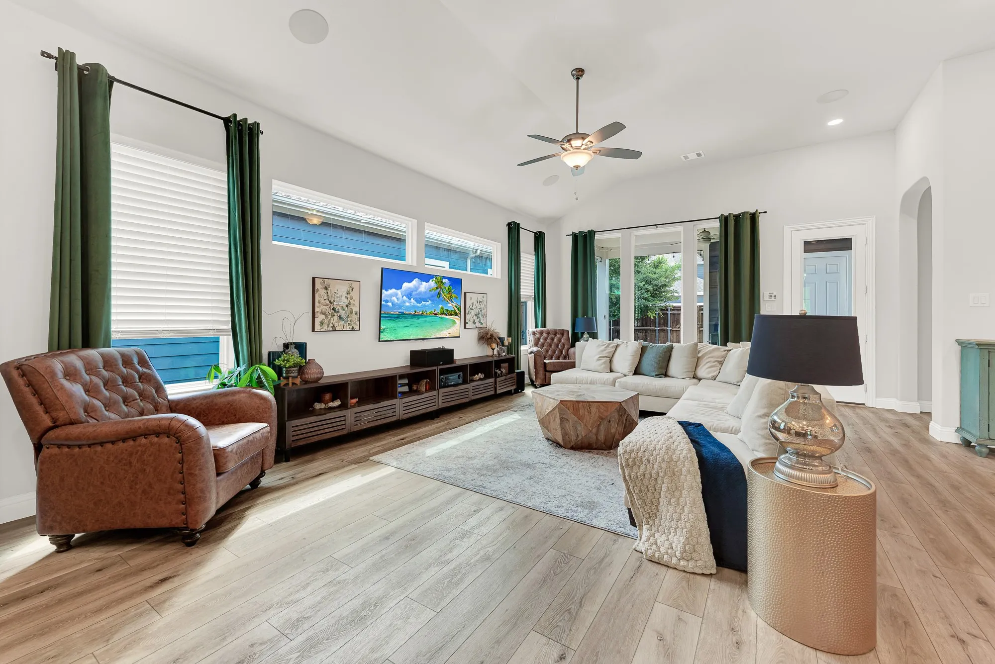Bright living room with lvp flooring and abundant natural light