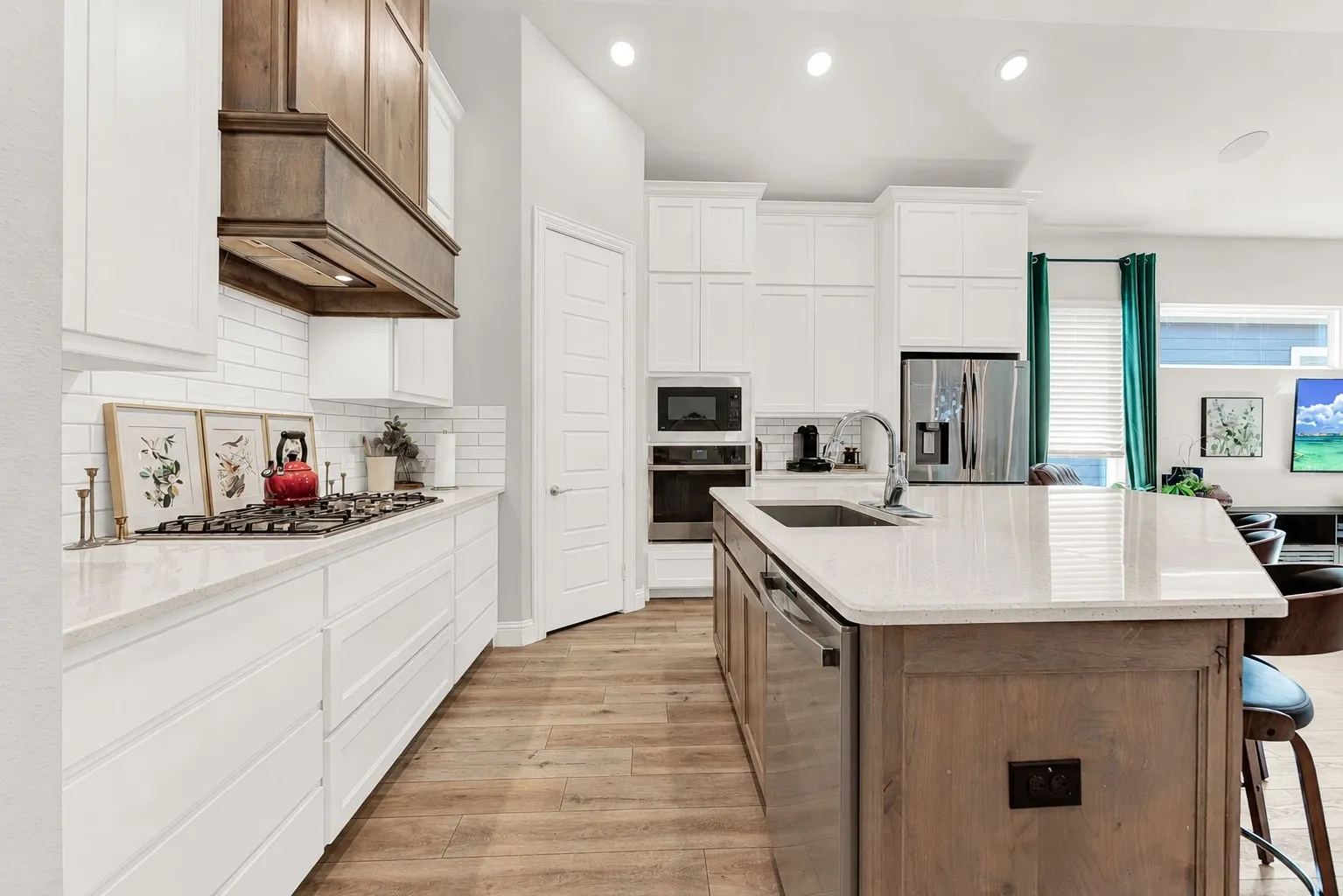 Modern kitchen featuring 36-inch gas range, quartz counters, Craftsman home Rowlett