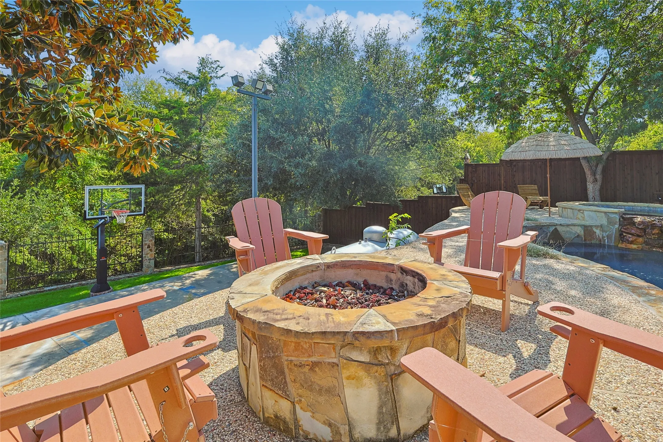 View of patio / terrace with a fenced backyard and a fire pit