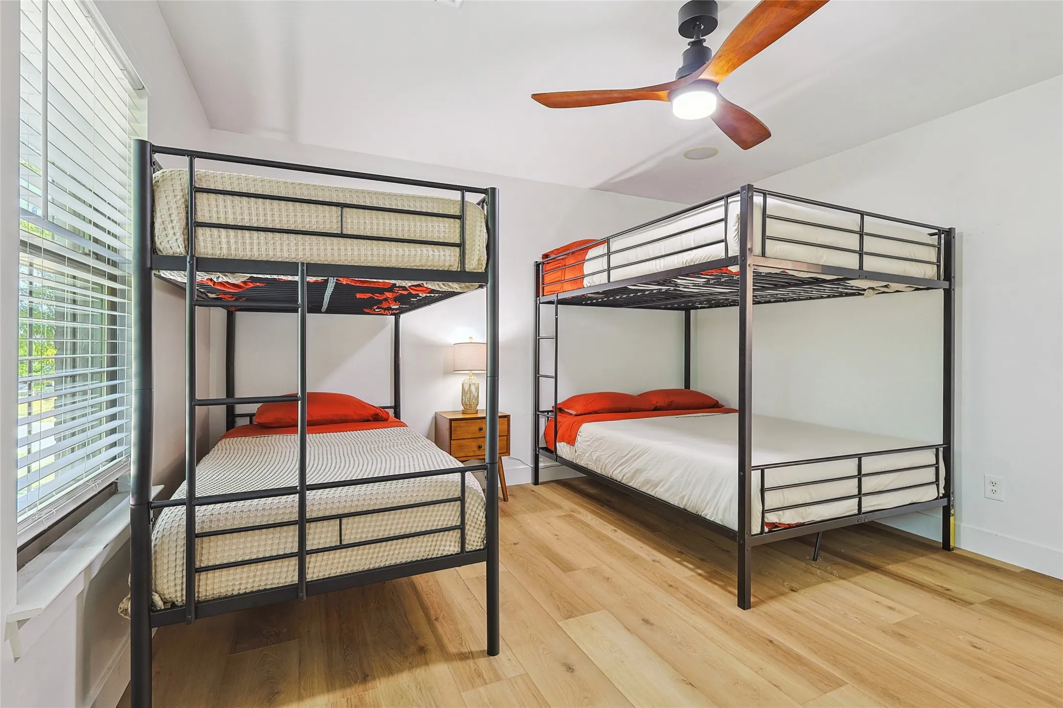 Bedroom featuring baseboards and wood finished floors