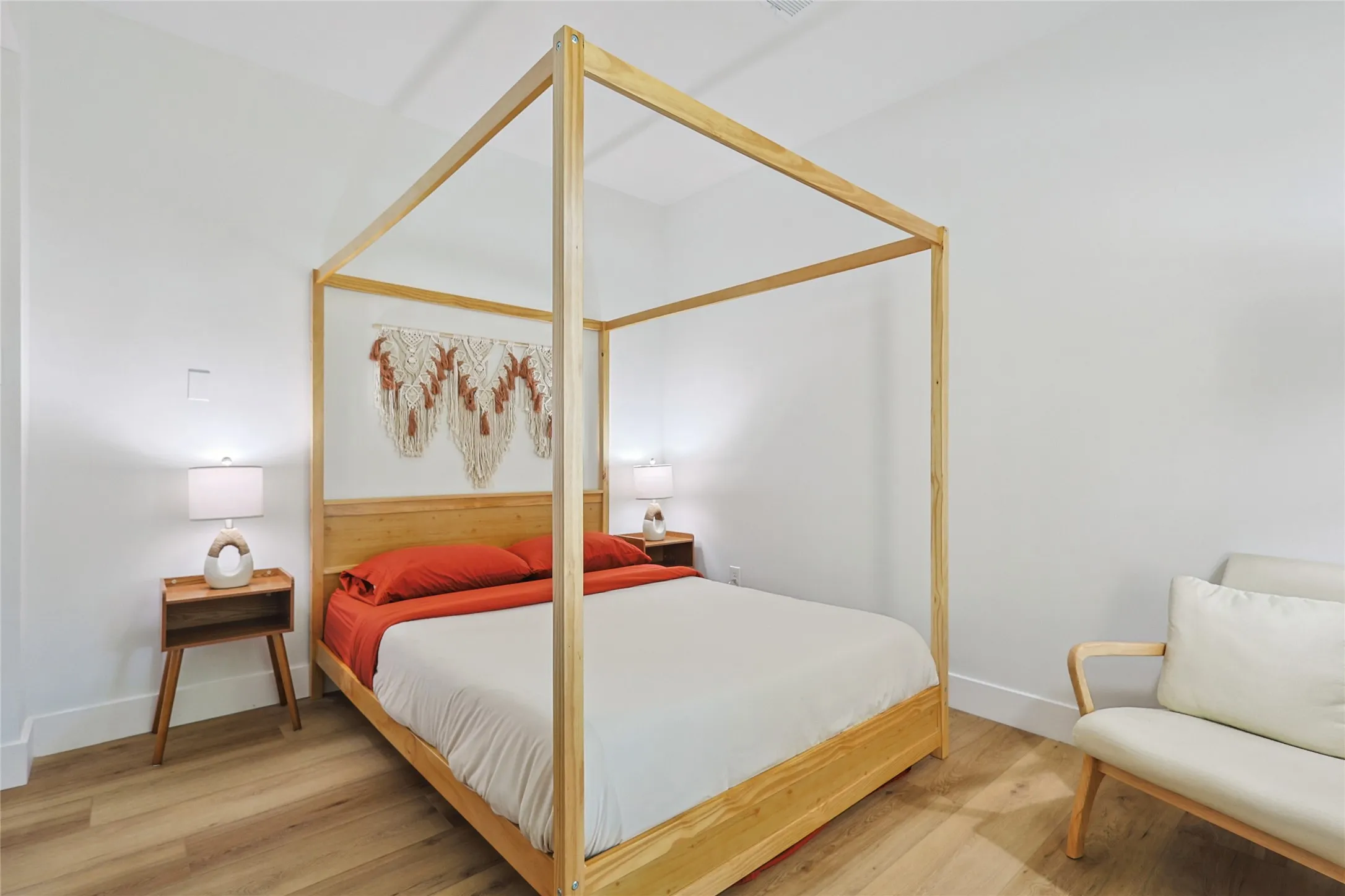 Bedroom featuring baseboards and wood finished floors