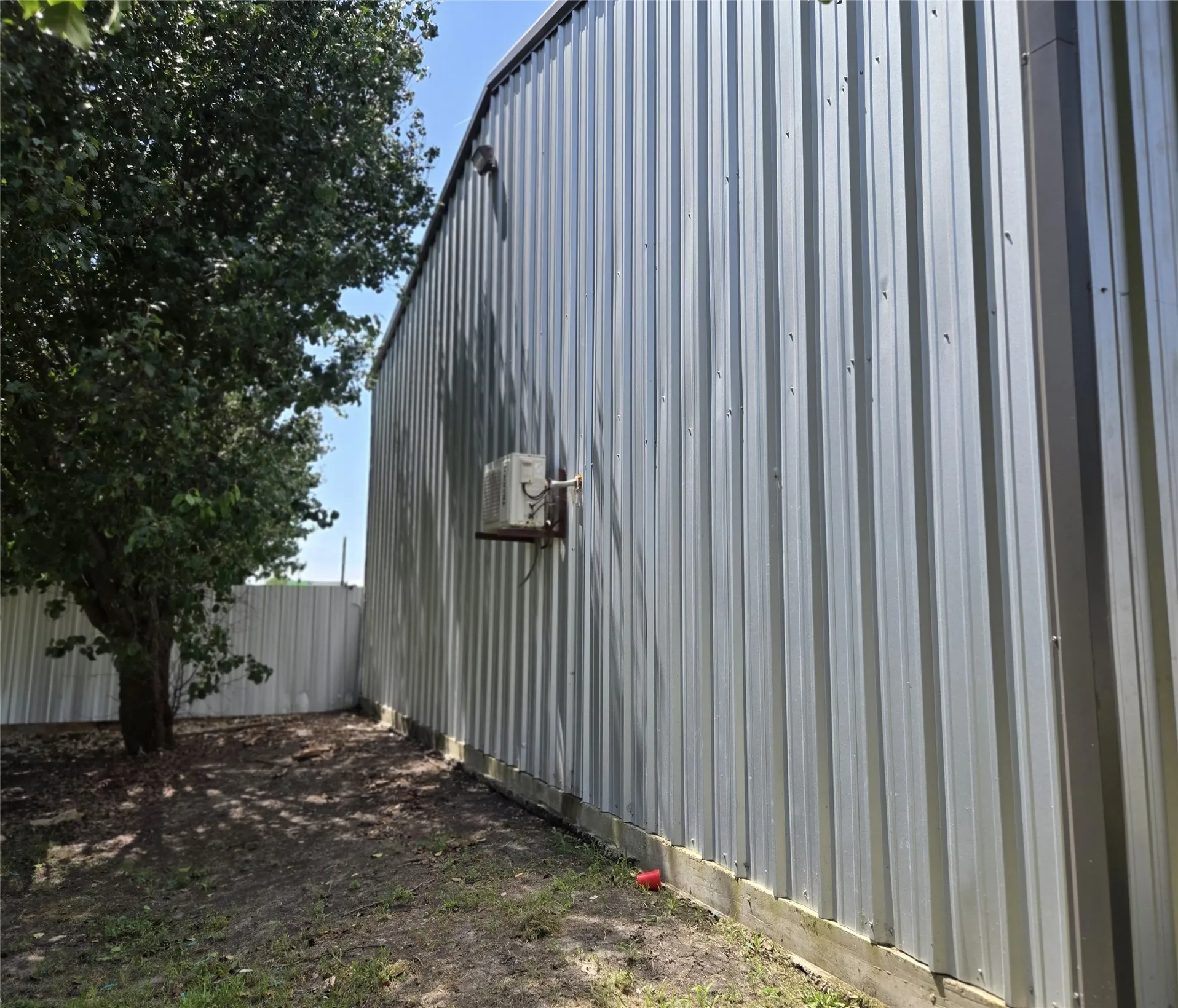 Metal siding exterior with a wood base