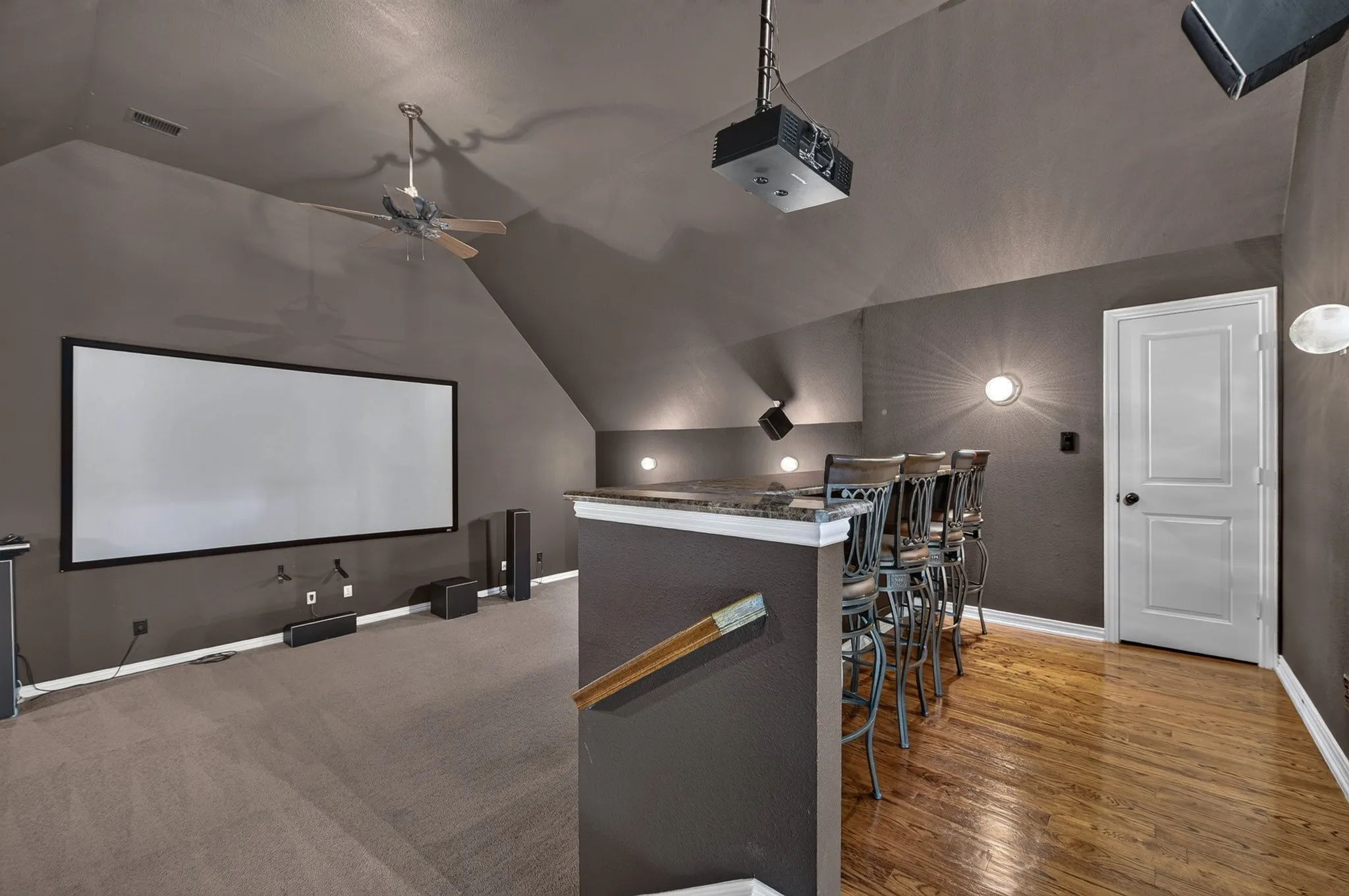 Oversized media room with tiered level, built in bar space, 2 closets for ample storage and all equipment to remain with acceptable offer